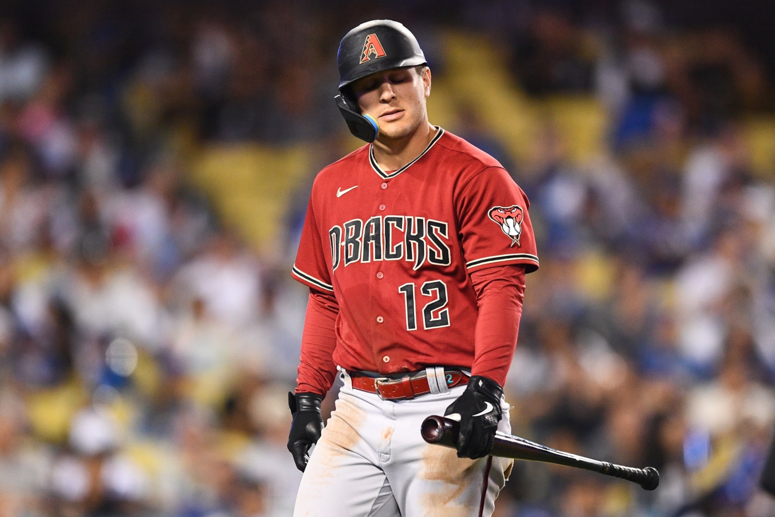 LOS ANGELES, CA - SEPTEMBER 21: Arizona Diamondbacks designated hitter Daulton Varsho (12) walks back to the dugout after striking out during the MLB game between the Arizona Diamondbacks and the Los Angeles Dodgers on September 21, 2022 at Dodger Stadium in Los Angeles, CA. (Photo by Brian Rothmuller/Icon Sportswire via Getty Images)