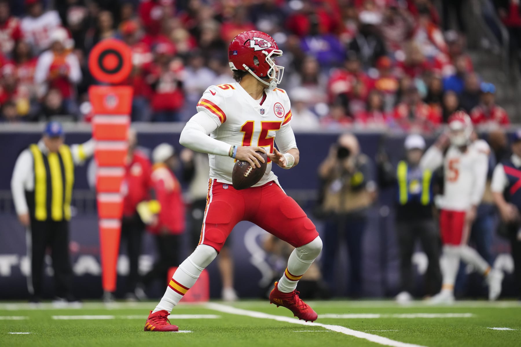HOUSTON, TX - DECEMBER 18: Patrick Mahomes #15 of the Kansas City Chiefs throws the ball against the Houston Texans at NRG Stadium on December 18, 2022 in Houston, Texas. (Photo by Cooper Neill/Getty Images)