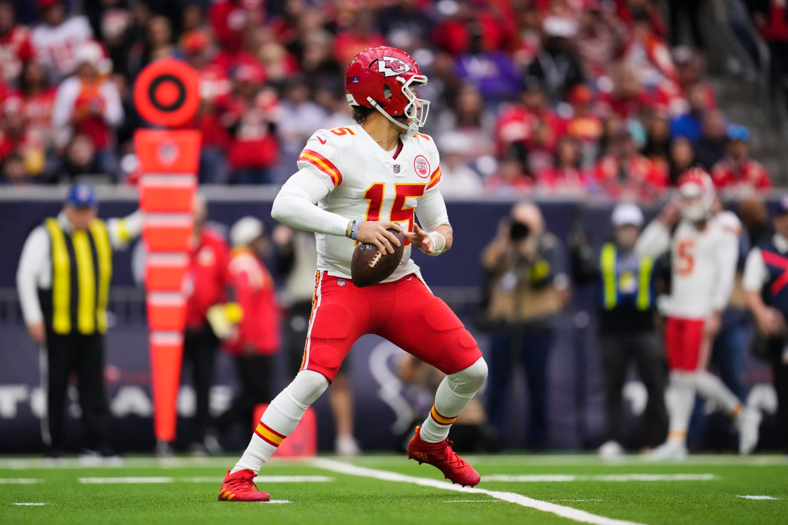 HOUSTON, TX - DECEMBER 18: Patrick Mahomes #15 of the Kansas City Chiefs throws the ball against the Houston Texans at NRG Stadium on December 18, 2022 in Houston, Texas. (Photo by Cooper Neill/Getty Images)