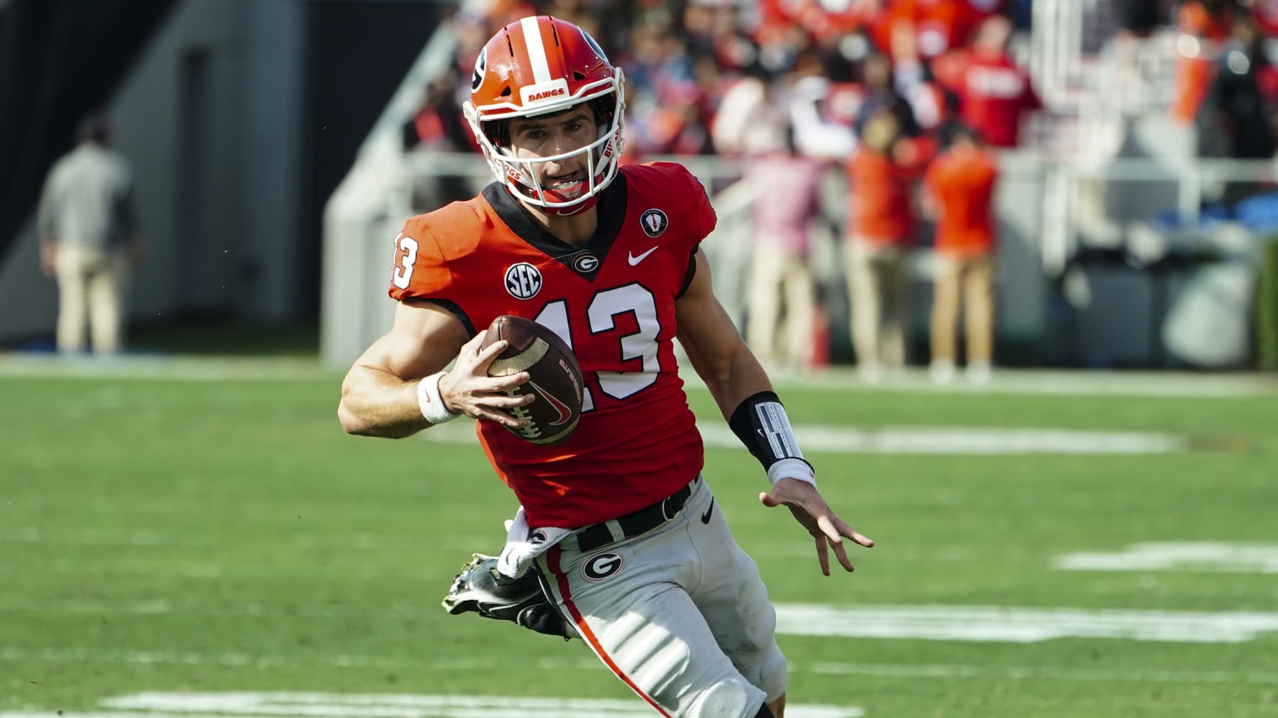 Georgia quarterback Stetson Bennett (13) runs the ball during the first half of an NCAA college football game against Georgia Tech Saturday, Nov. 26, 2022 in Athens, Ga. (AP Photo/John Bazemore)