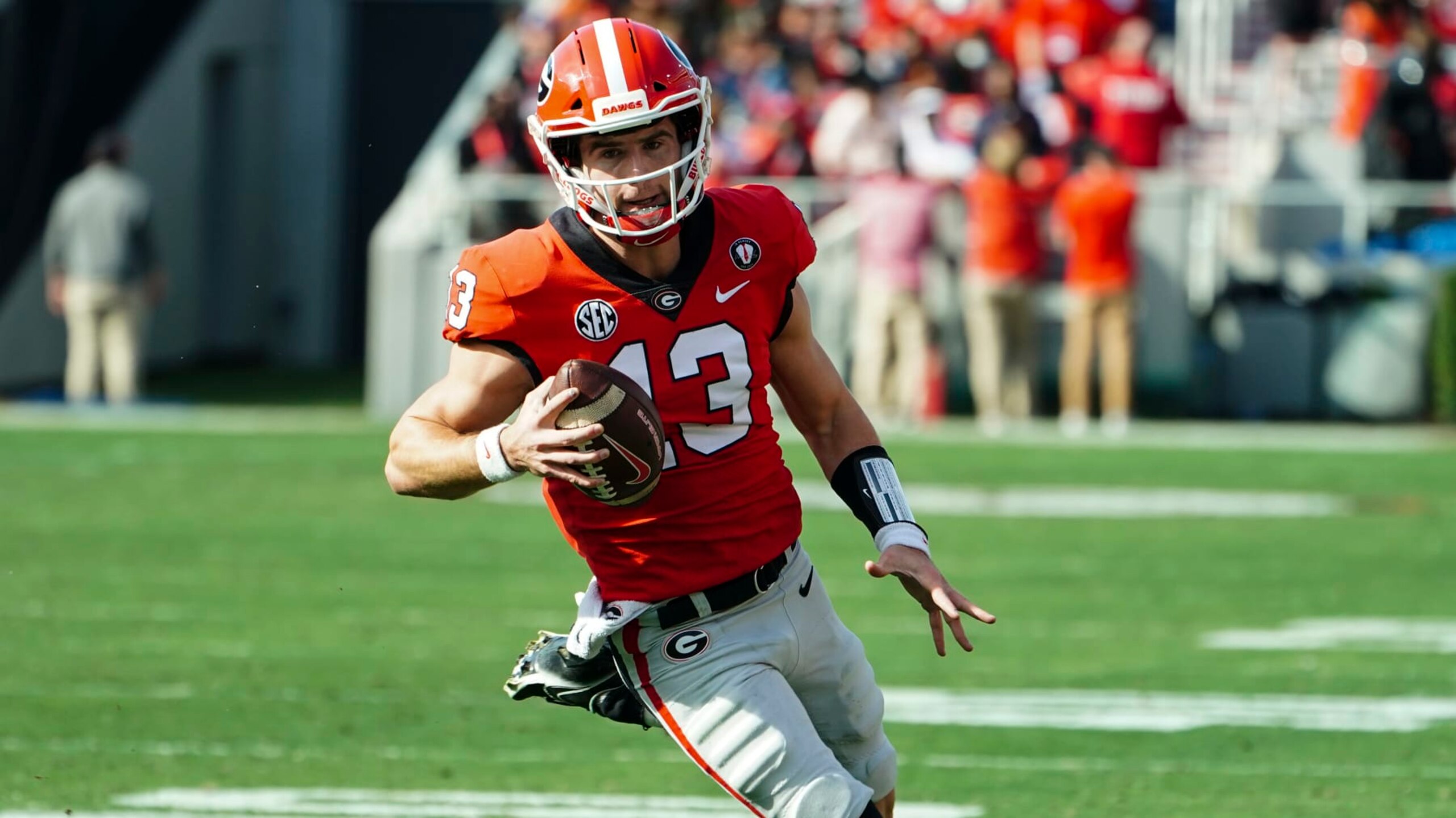 Georgia quarterback Stetson Bennett (13) runs the ball during the first half of an NCAA college football game against Georgia Tech Saturday, Nov. 26, 2022 in Athens, Ga. (AP Photo/John Bazemore)