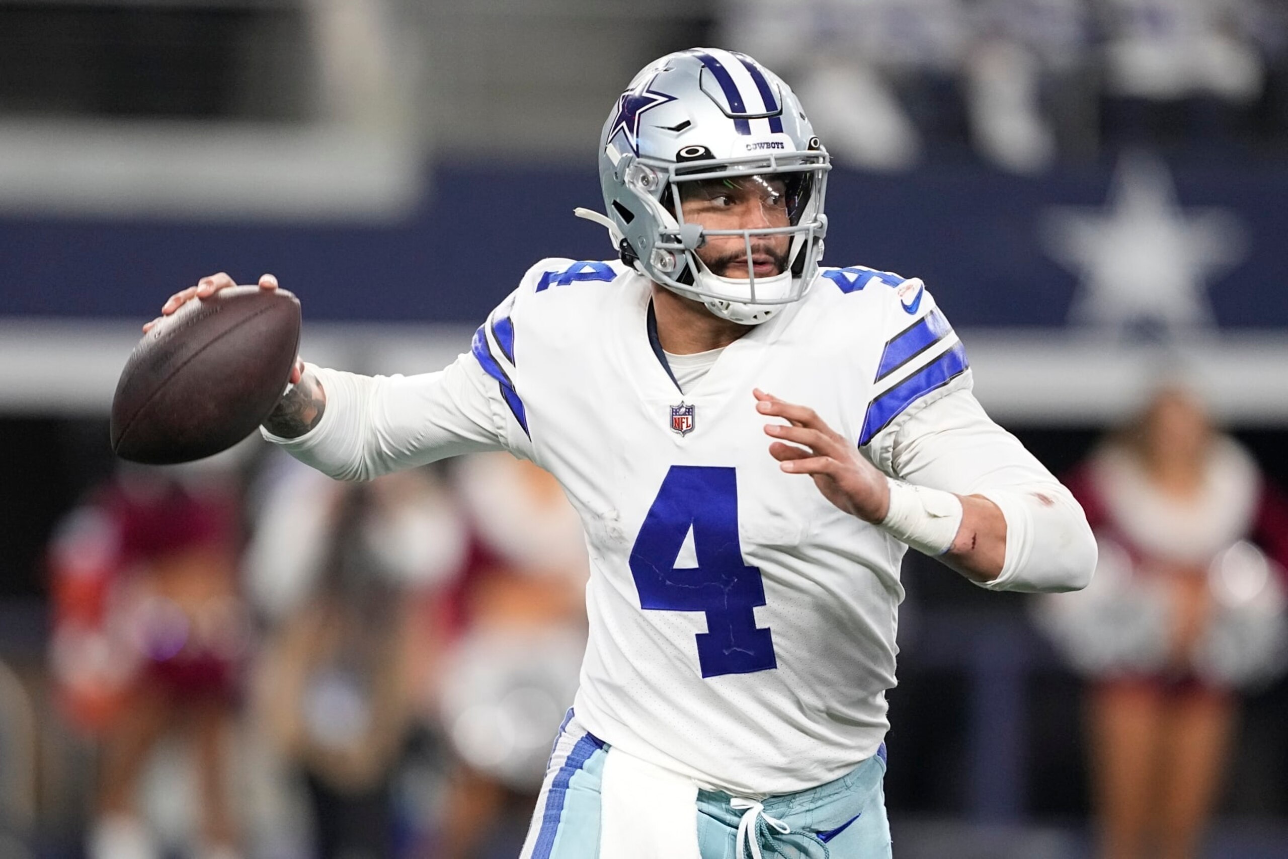 Dallas Cowboys' Dak Prescott throws during the second half of an NFL football game against the Philadelphia Eagles Saturday, Dec. 24, 2022, in Arlington, Texas. (AP Photo/Tony Gutierrez)