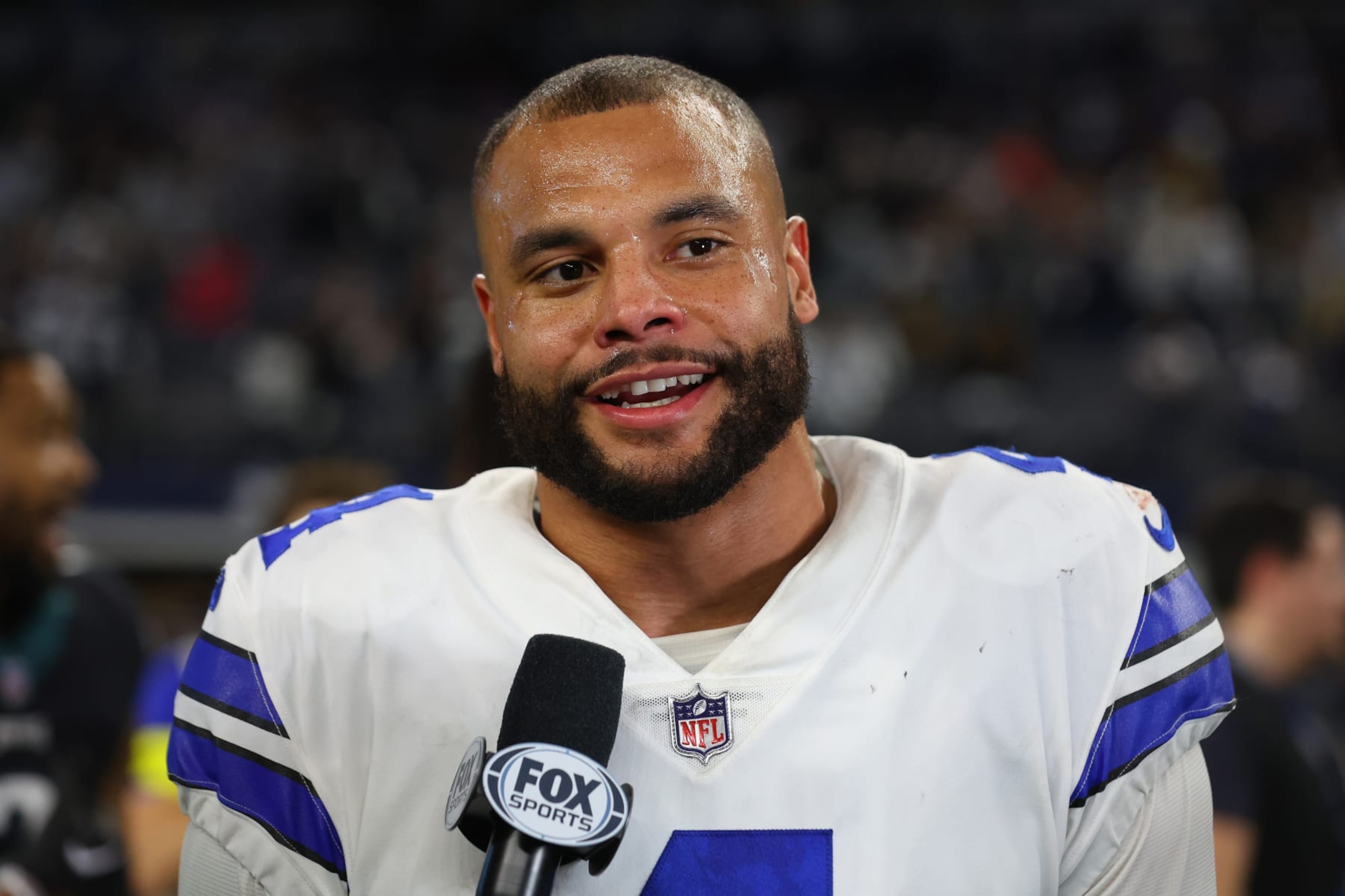 ARLINGTON, TEXAS - DECEMBER 24: Dak Prescott #4 of the Dallas Cowboys speaks to a reporter after a win over the Philadelphia Eagles at AT&T Stadium on December 24, 2022 in Arlington, Texas. (Photo by Richard Rodriguez/Getty Images) ARLINGTON, TEXAS - DECEMBER 24: Dak Prescott #4 of the Dallas Cowboys speaks to a reporter after a win over the Philadelphia Eagles at AT&T Stadium on December 24, 2022 in Arlington, Texas. (Photo by Richard Rodriguez/Getty Images)