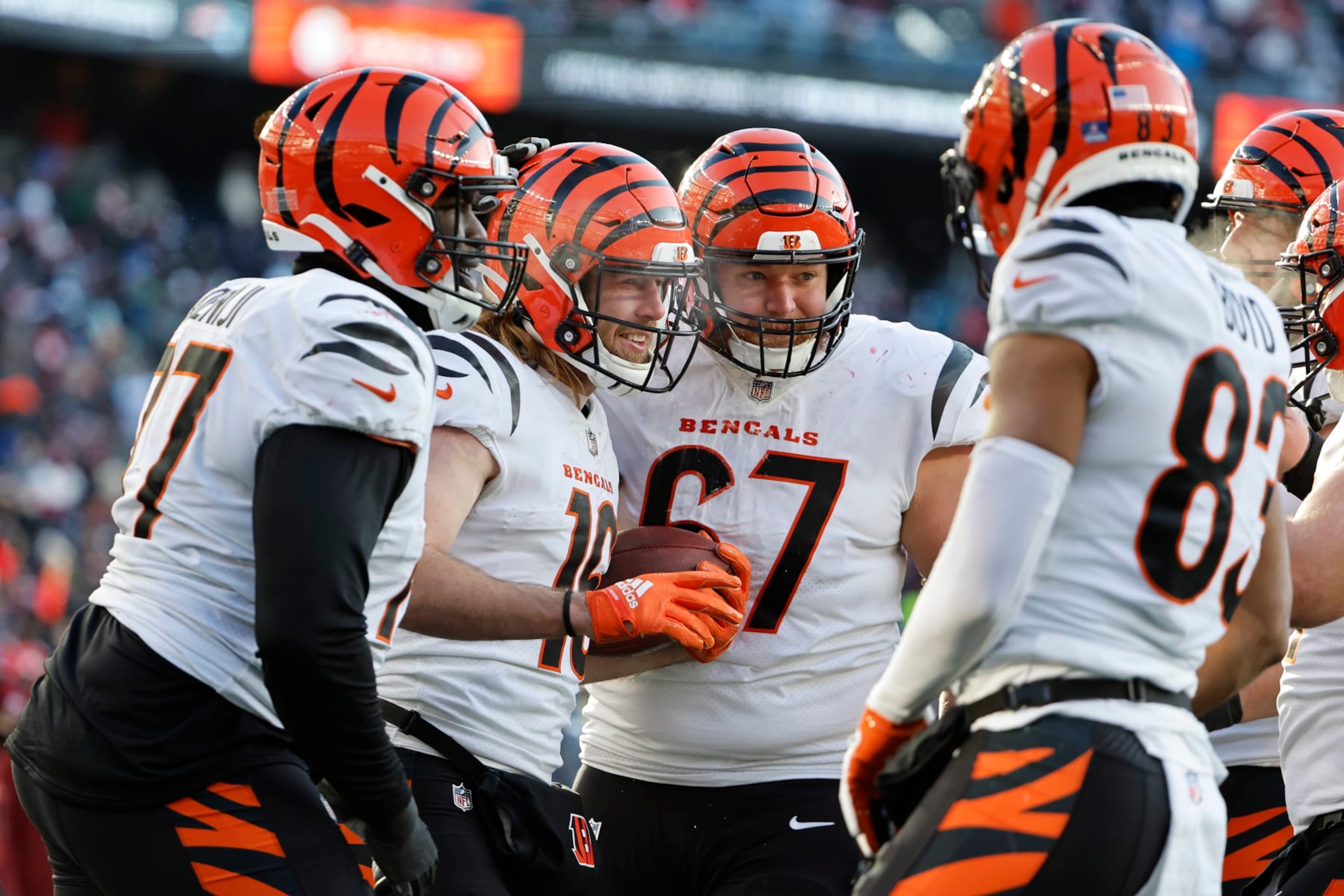 FOXBOROUGH, MASSACHUSETTS - DECEMBER 24: Cincinnati Bengals players celebrate  with Trenton Irwin #16 of the Cincinnati Bengals after his receiving touchdown  during the second quarterat Gillette Stadium on December 24, 2022 in Foxborough, Massachusetts. (Photo by Winslow Townson/Getty Images)