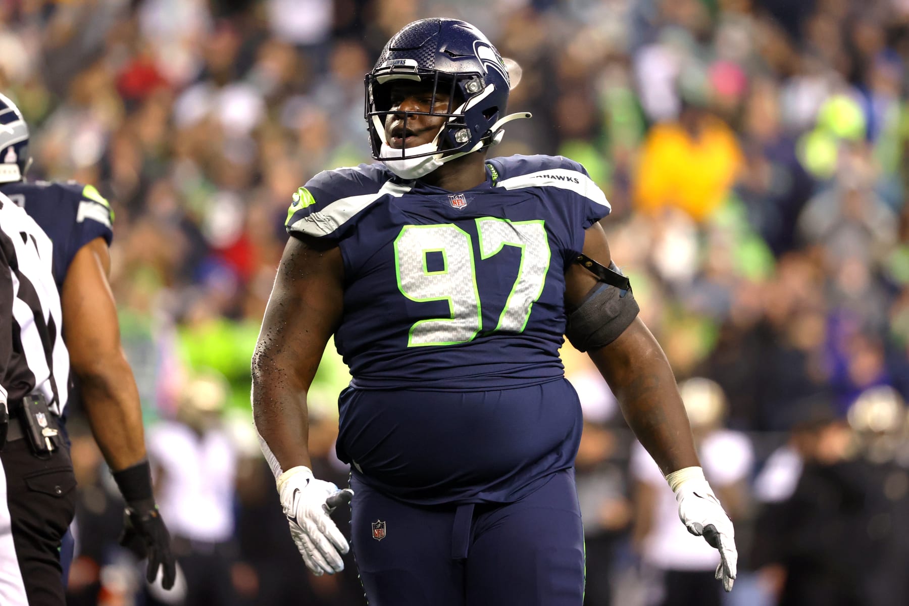 SEATTLE, WASHINGTON - OCTOBER 25: Poona Ford #97 of the Seattle Seahawks looks on against the New Orleans Saints during the second quarter at Lumen Field on October 25, 2021 in Seattle, Washington. (Photo by Abbie Parr/Getty Images)