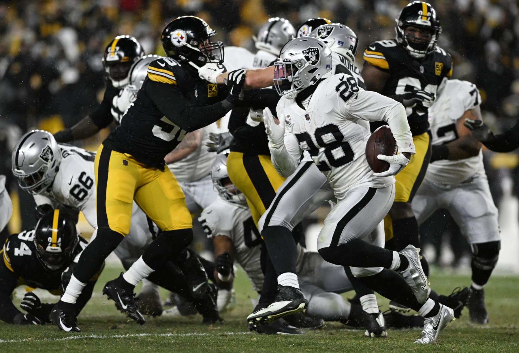 PITTSBURGH, PENNSYLVANIA - DECEMBER 24: Josh Jacobs #28 of the Las Vegas Raiders runs the ball during the third quarter against the Pittsburgh Steelers at Acrisure Stadium on December 24, 2022 in Pittsburgh, Pennsylvania. (Photo by Gaelen Morse/Getty Images)