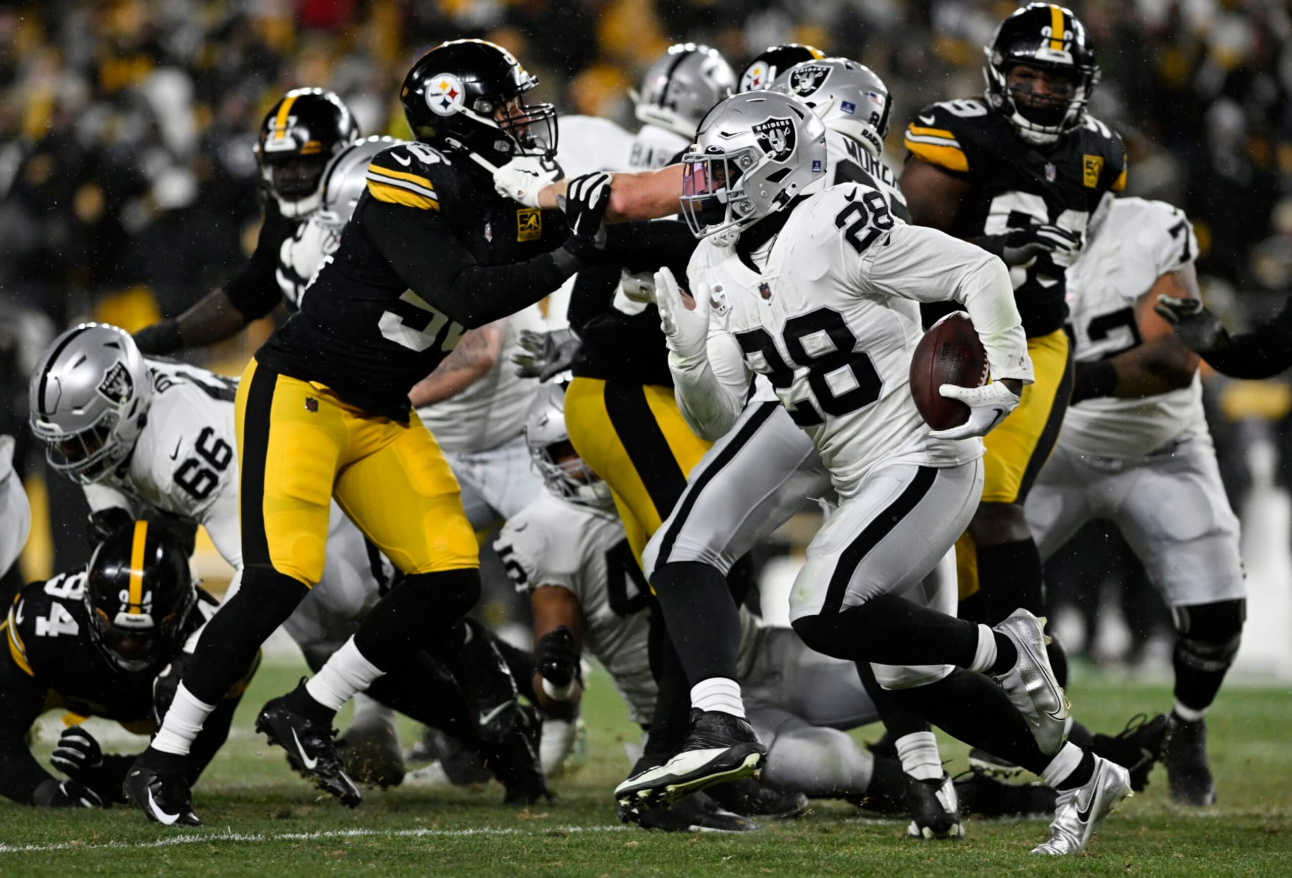 PITTSBURGH, PENNSYLVANIA - DECEMBER 24: Josh Jacobs #28 of the Las Vegas Raiders runs the ball during the third quarter against the Pittsburgh Steelers at Acrisure Stadium on December 24, 2022 in Pittsburgh, Pennsylvania. (Photo by Gaelen Morse/Getty Images)