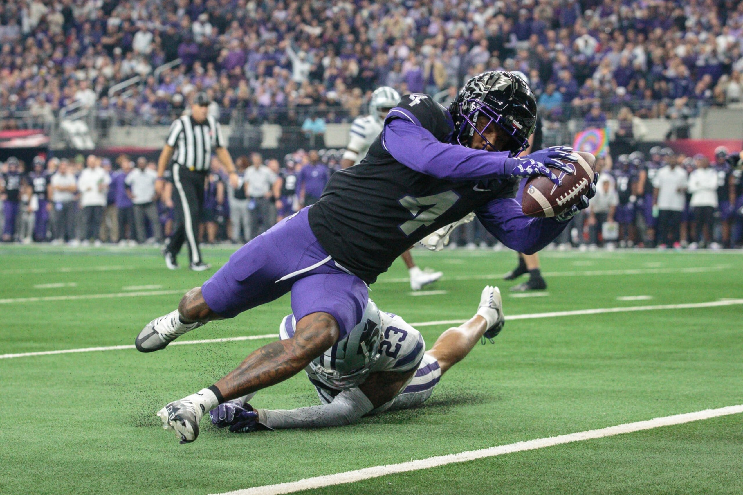 ARLINGTON, TX - DECEMBER 03: TCU Horned Frogs wide receiver Taye Barber (4) dives for a touchdown against the Kansas State Wildcats on December 3rd, 2022 at ATT Stadium in Arlington, Texas. (Photo by William Purnell/Icon Sportswire via Getty Images) ARLINGTON, TX - DECEMBER 03: TCU Horned Frogs wide receiver Taye Barber (4) dives for a touchdown against the Kansas State Wildcats on December 3rd, 2022 at ATT Stadium in Arlington, Texas. (Photo by William Purnell/Icon Sportswire via Getty Images)
