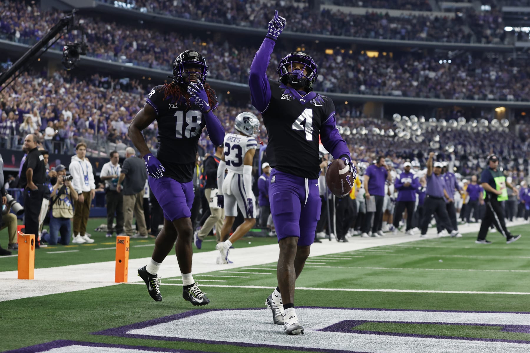 ARLINGTON, TEXAS - DECEMBER 03: Wide receiver Taye Barber #4 of the TCU Horned Frogs celebrates scoring a touchdown in the first quarter against the Kansas State Wildcats at AT&T Stadium on December 03, 2022 in Arlington, Texas. (Photo by Tim Heitman/Getty Images)