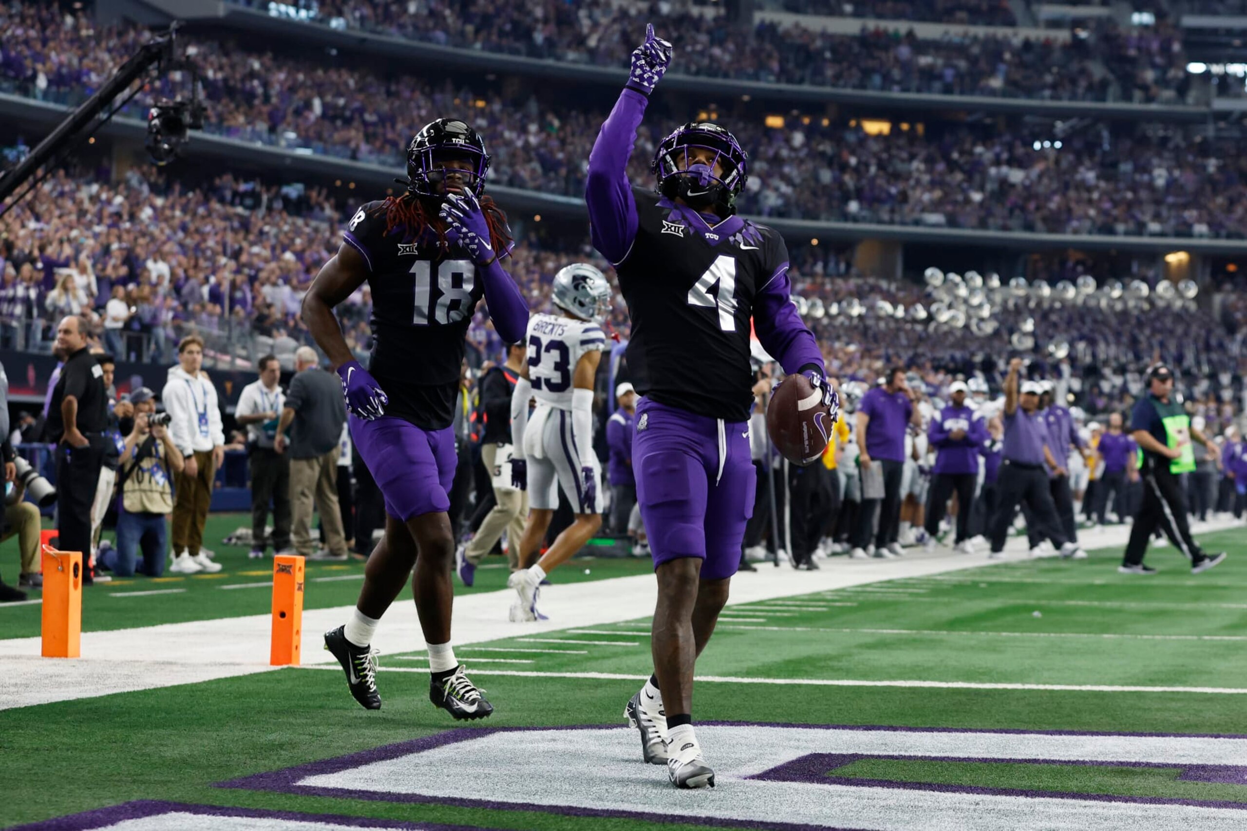 ARLINGTON, TEXAS - DECEMBER 03: Wide receiver Taye Barber #4 of the TCU Horned Frogs celebrates scoring a touchdown in the first quarter against the Kansas State Wildcats at AT&T Stadium on December 03, 2022 in Arlington, Texas. (Photo by Tim Heitman/Getty Images) ARLINGTON, TEXAS - DECEMBER 03: Wide receiver Taye Barber #4 of the TCU Horned Frogs celebrates scoring a touchdown in the first quarter against the Kansas State Wildcats at AT&T Stadium on December 03, 2022 in Arlington, Texas. (Photo by Tim Heitman/Getty Images)