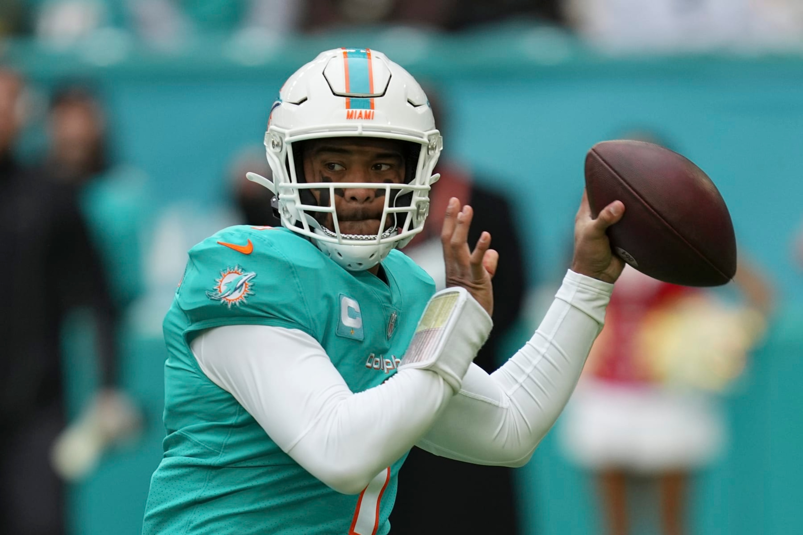 Miami Dolphins quarterback Tua Tagovailoa (1) looks to pass during the first half of an NFL football game against the Green Bay Packers, Sunday, Dec. 25, 2022, in Miami Gardens, Fla. (AP Photo/Jim Rassol)