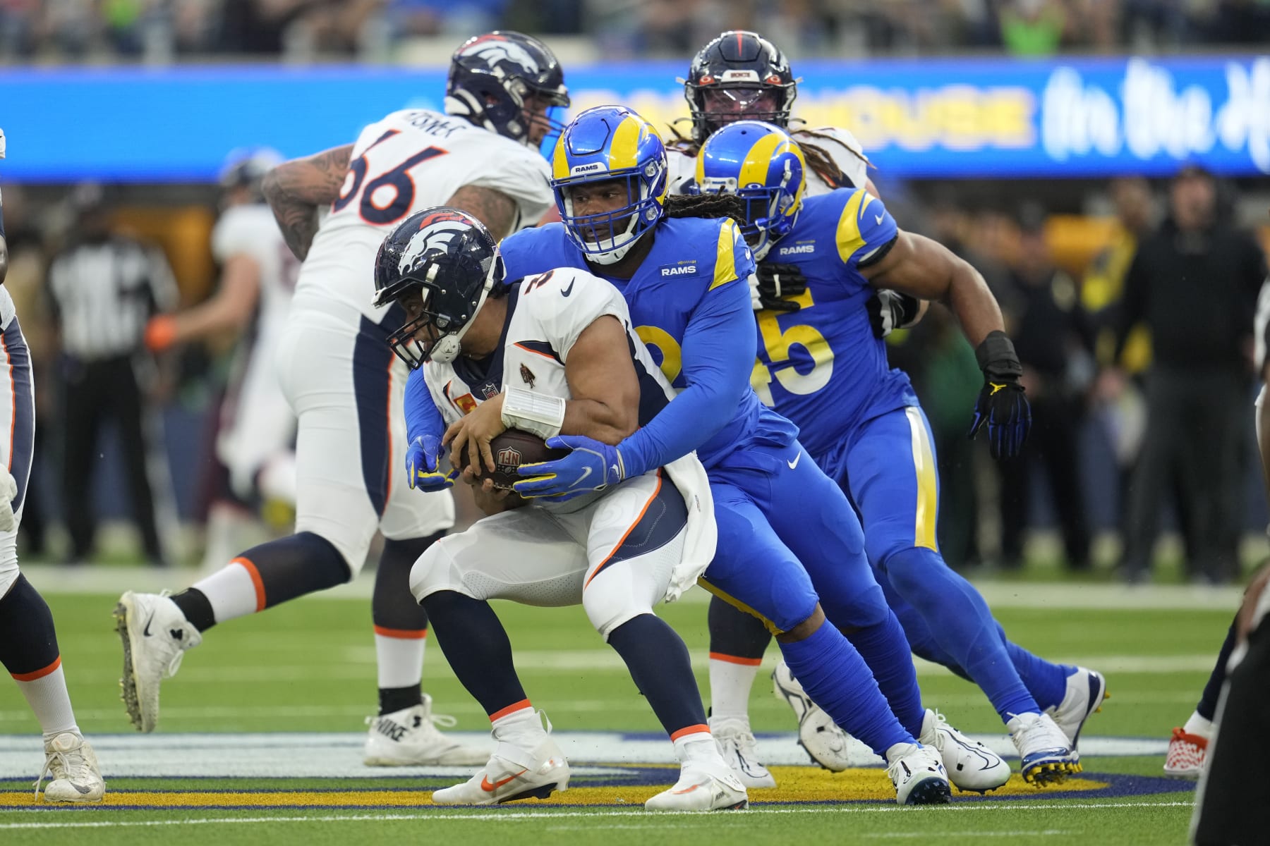 Los Angeles Rams' Terrell Lewis sacks Denver Broncos quarterback Russell Wilson during the first half of an NFL football game between the Los Angeles Rams and the Denver Broncos on Sunday, Dec. 25, 2022, in Inglewood, Calif.(AP Photo/Marcio J. Sanchez)