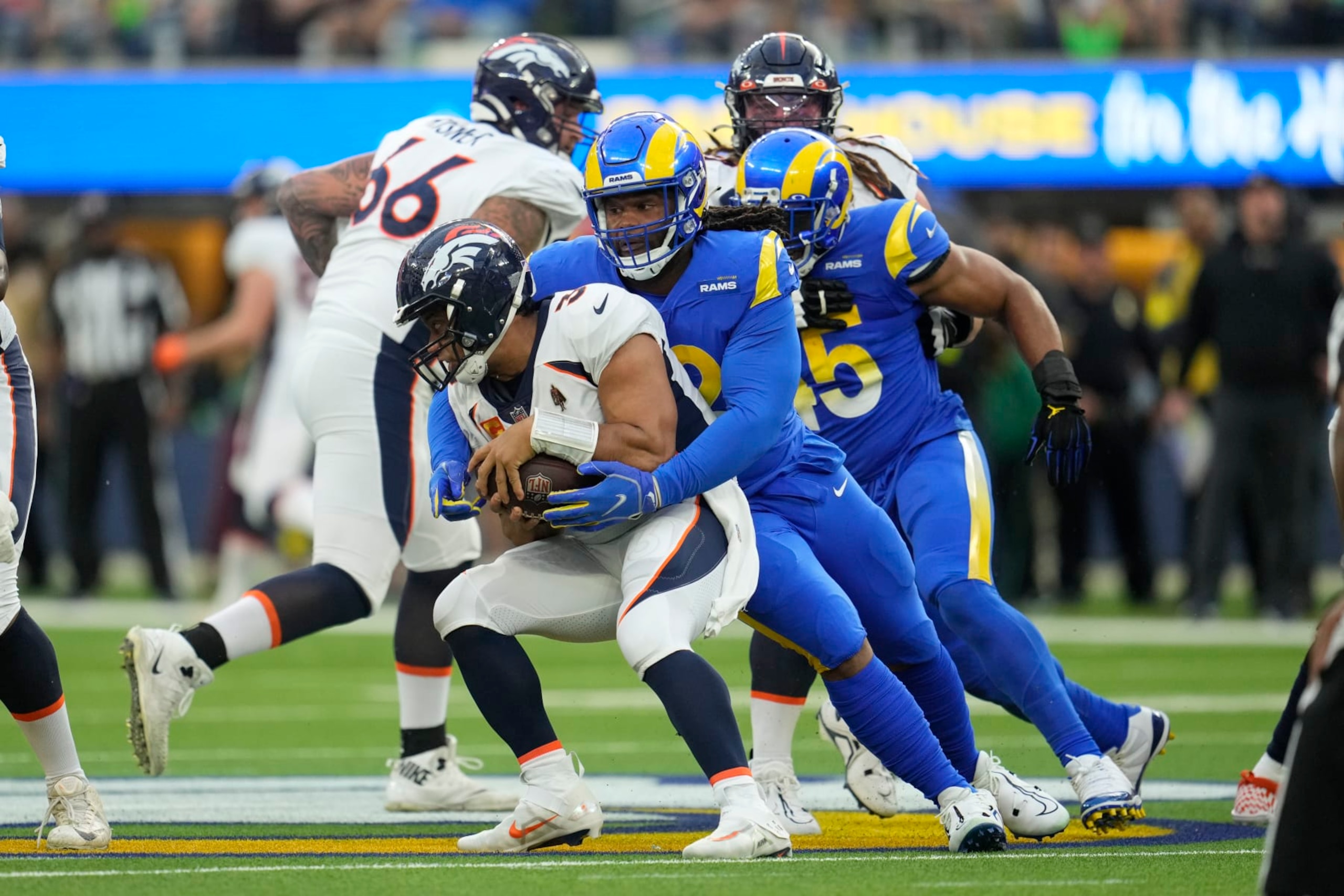 Los Angeles Rams' Terrell Lewis sacks Denver Broncos quarterback Russell Wilson during the first half of an NFL football game between the Los Angeles Rams and the Denver Broncos on Sunday, Dec. 25, 2022, in Inglewood, Calif.(AP Photo/Marcio J. Sanchez)