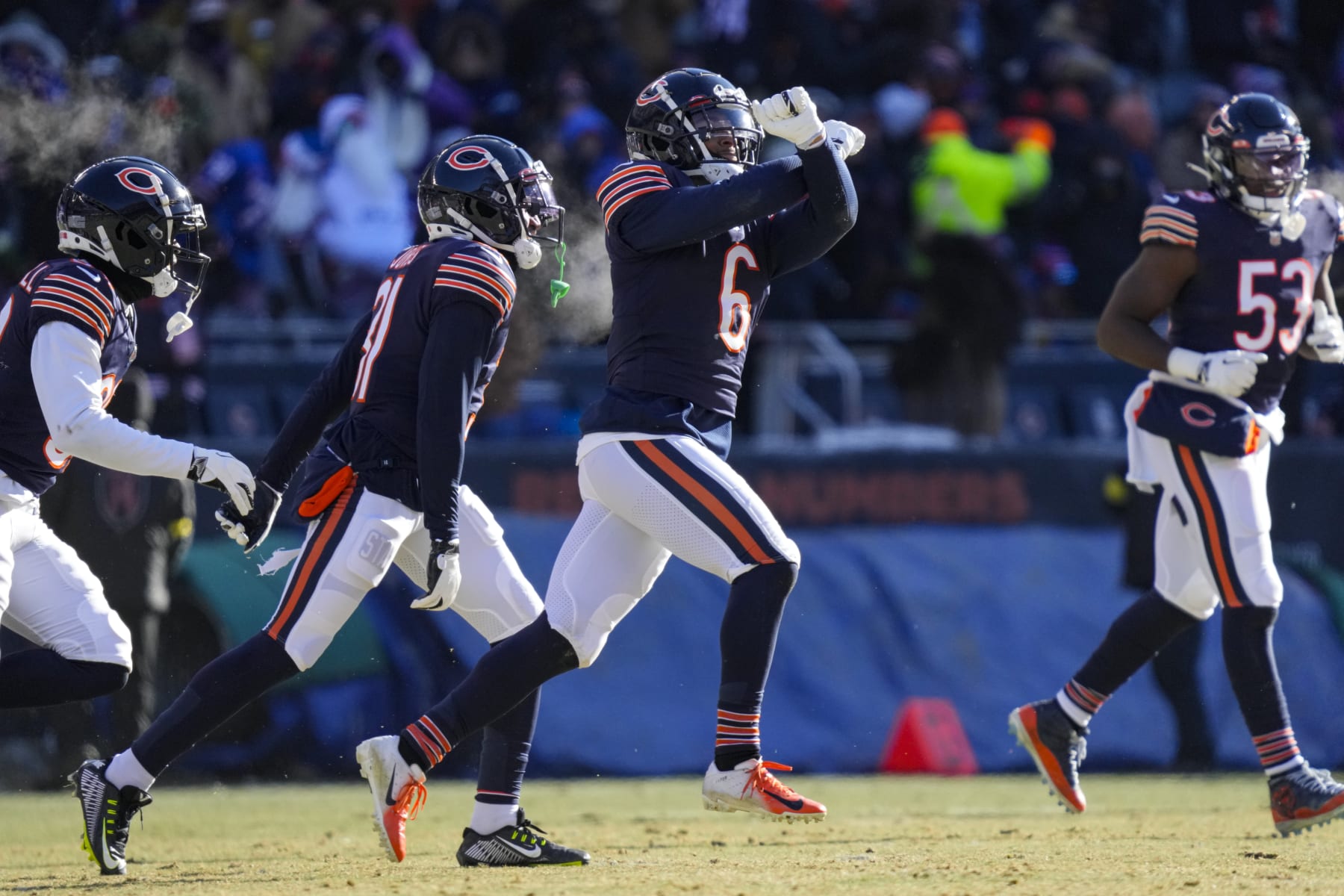 Chicago Bears cornerback Kyler Gordon (6) celebrates after an interception against the Buffalo Bills in the first half of an NFL football game in Chicago, Saturday, Dec. 24, 2022. (AP Photo/Nam Y. Huh)