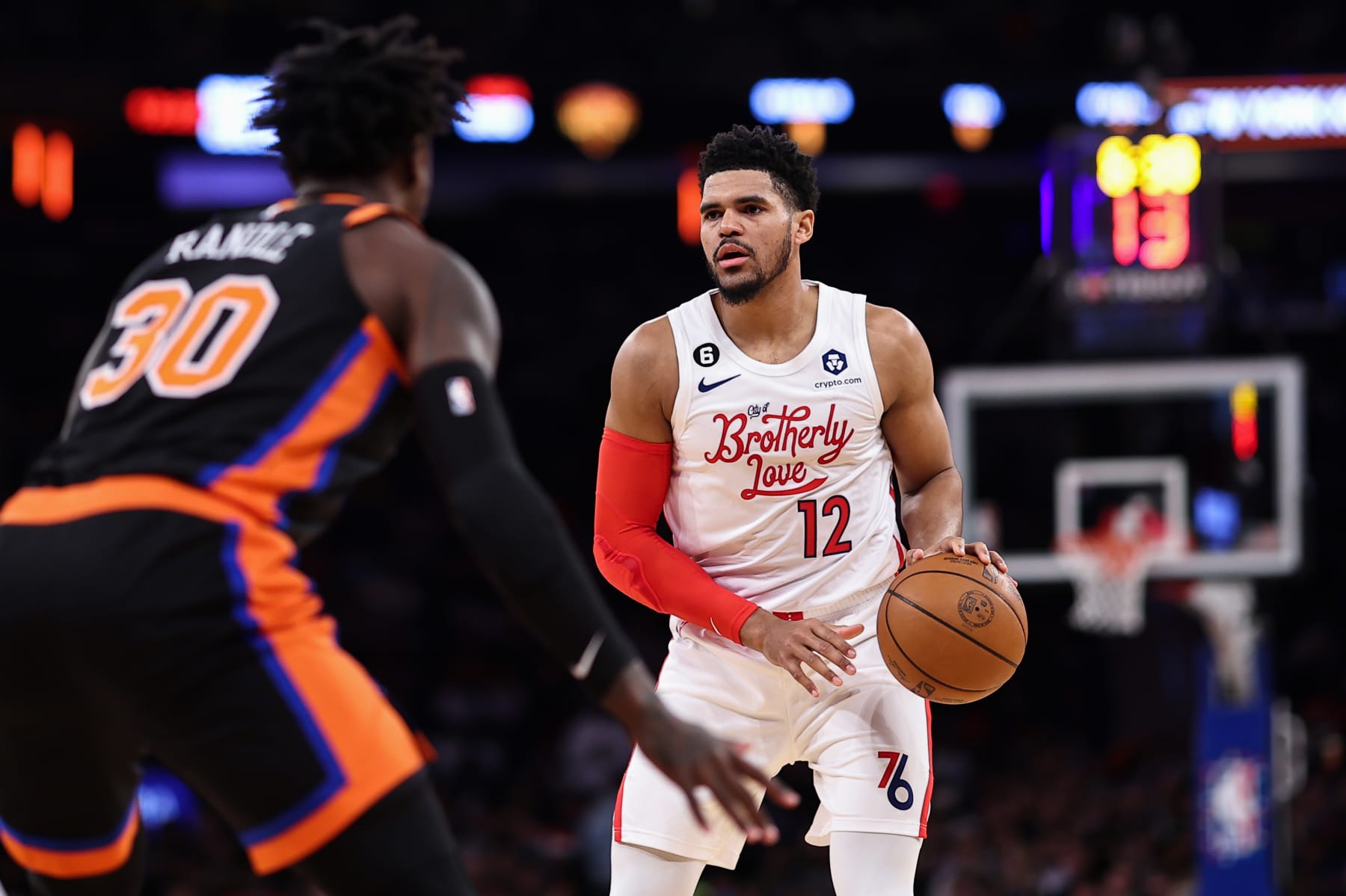 NEW YORK, NEW YORK - DECEMBER 25: Tobias Harris #12 of the Philadelphia 76ers is guarded by Julius Randle #30 of the New York Knicks during the first quarter of the game at Madison Square Garden on December 25, 2022 in New York City.  NOTE TO USER: User expressly acknowledges and agrees that, by downloading and or using this photograph, User is consenting to the terms and conditions of the Getty Images License Agreement. (Photo by Dustin Satloff/Getty Images)