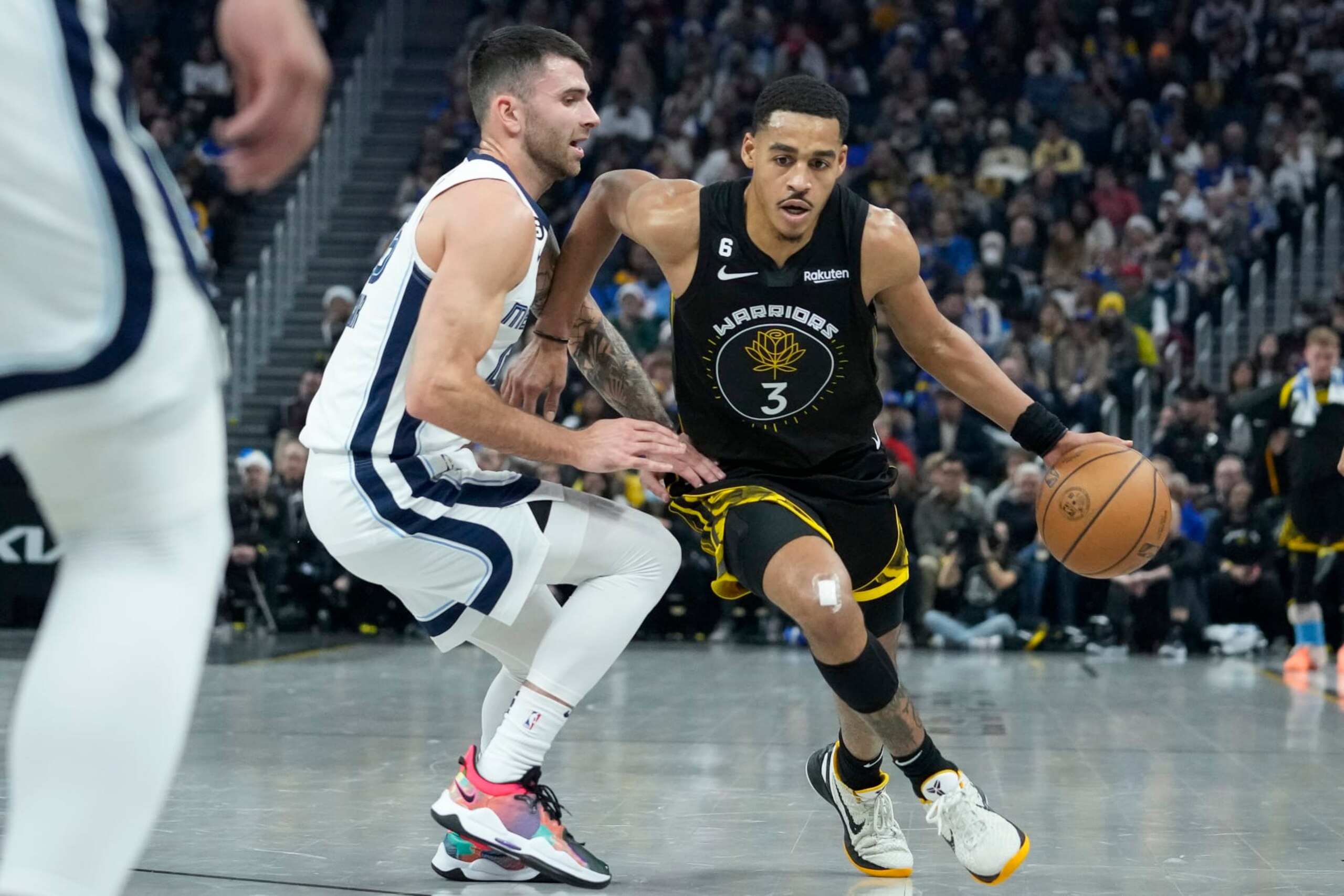 Golden State Warriors guard Jordan Poole, right, drives to the basket against Memphis Grizzlies guard John Konchar during the first half of an NBA basketball game in San Francisco, Sunday, Dec. 25, 2022. (AP Photo/Godofredo A. Vásquez) Golden State Warriors guard Jordan Poole, right, drives to the basket against Memphis Grizzlies guard John Konchar during the first half of an NBA basketball game in San Francisco, Sunday, Dec. 25, 2022. (AP Photo/Godofredo A. Vásquez)