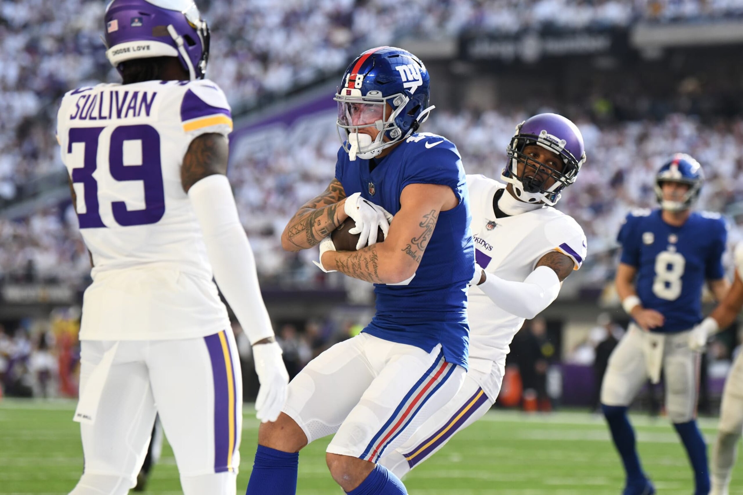 MINNEAPOLIS, MINNESOTA - DECEMBER 24: Isaiah Hodgins #18 of the New York Giants catches a touchdown pass against the Minnesota Vikings during the second quarter of the game at U.S. Bank Stadium on December 24, 2022 in Minneapolis, Minnesota. (Photo by Stephen Maturen/Getty Images)