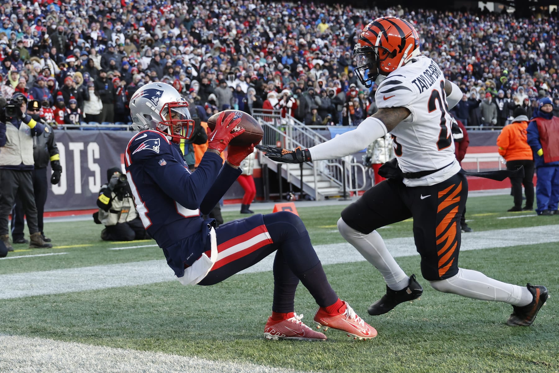 FOXBOROUGH, MASSACHUSETTS - DECEMBER 24: Kendrick Bourne #84 of the New England Patriots catches a touchdown over Cam Taylor-Britt #29 of the Cincinnati Bengals during the fourth quarter at Gillette Stadium on December 24, 2022 in Foxborough, Massachusetts. (Photo by Winslow Townson/Getty Images)