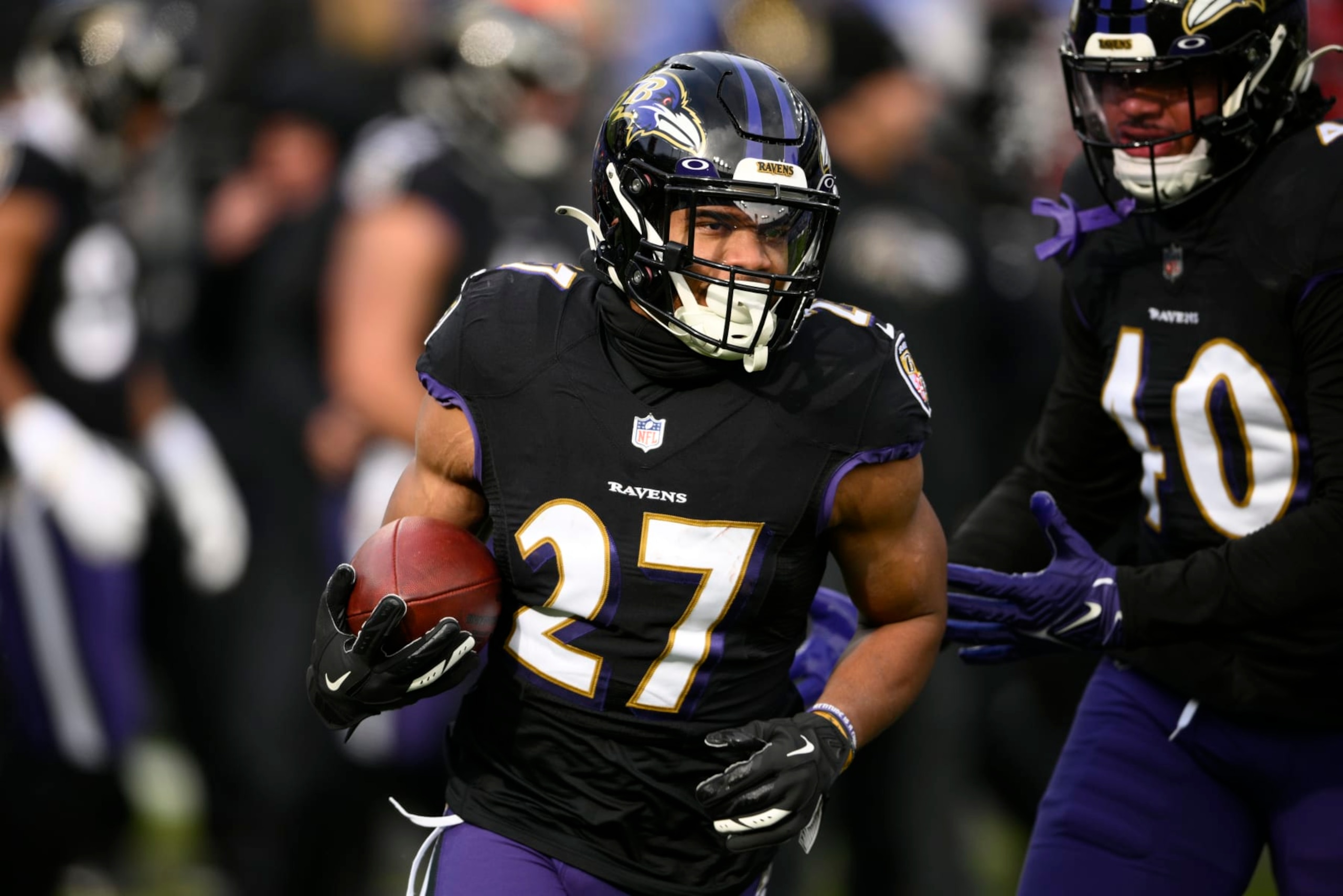 Baltimore Ravens running back J.K. Dobbins (27) warms up before of an NFL football game against the Atlanta Falcons, Saturday, Dec. 24, 2022, in Baltimore. (AP Photo/Nick Wass)