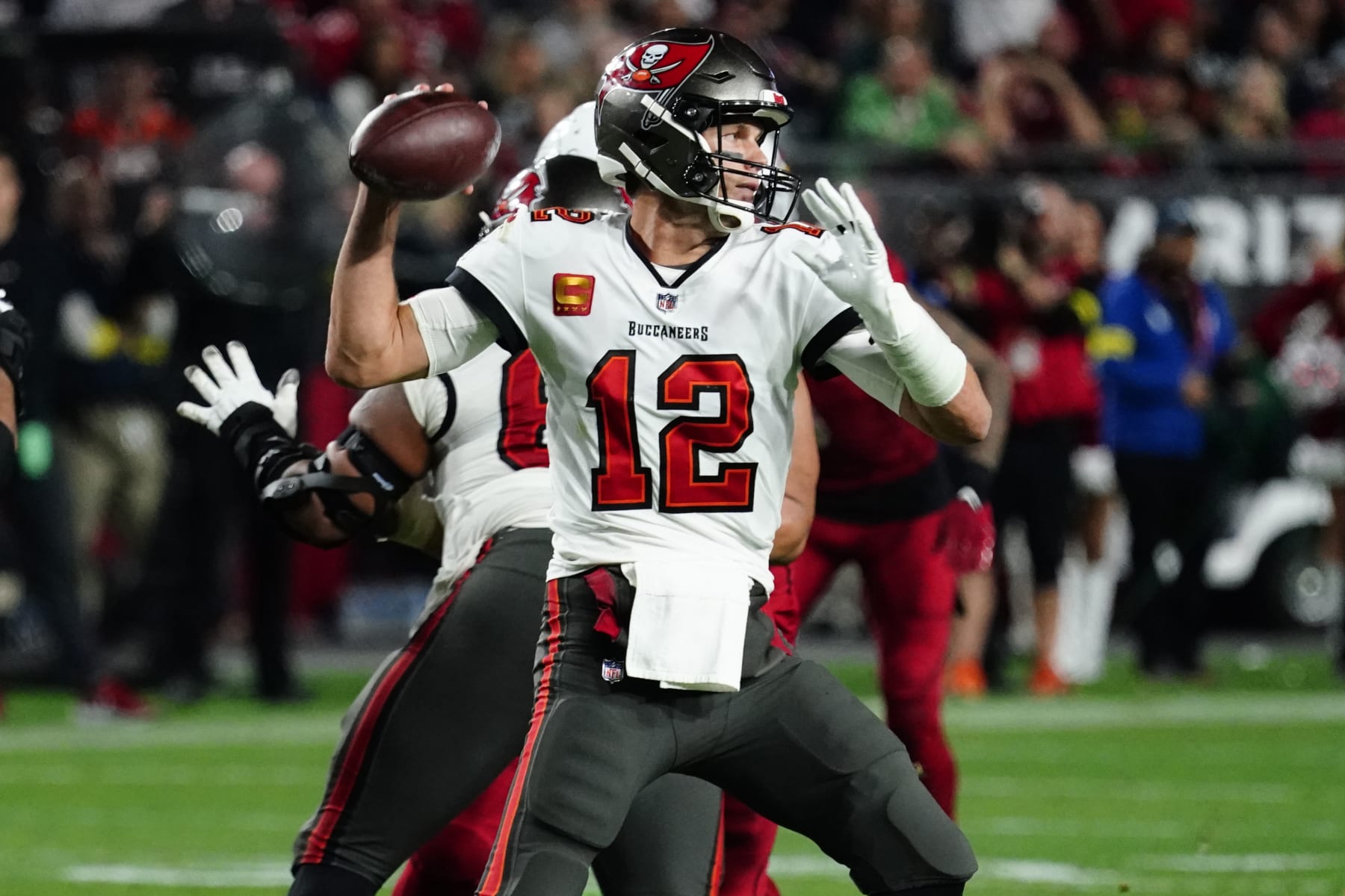 Tampa Bay Buccaneers quarterback Tom Brady (12) throws against the Arizona Cardinals during the second half of an NFL football game, Sunday, Dec. 25, 2022, in Glendale, Ariz. (AP Photo/Darryl Webb) Tampa Bay Buccaneers quarterback Tom Brady (12) throws against the Arizona Cardinals during the second half of an NFL football game, Sunday, Dec. 25, 2022, in Glendale, Ariz. (AP Photo/Darryl Webb)