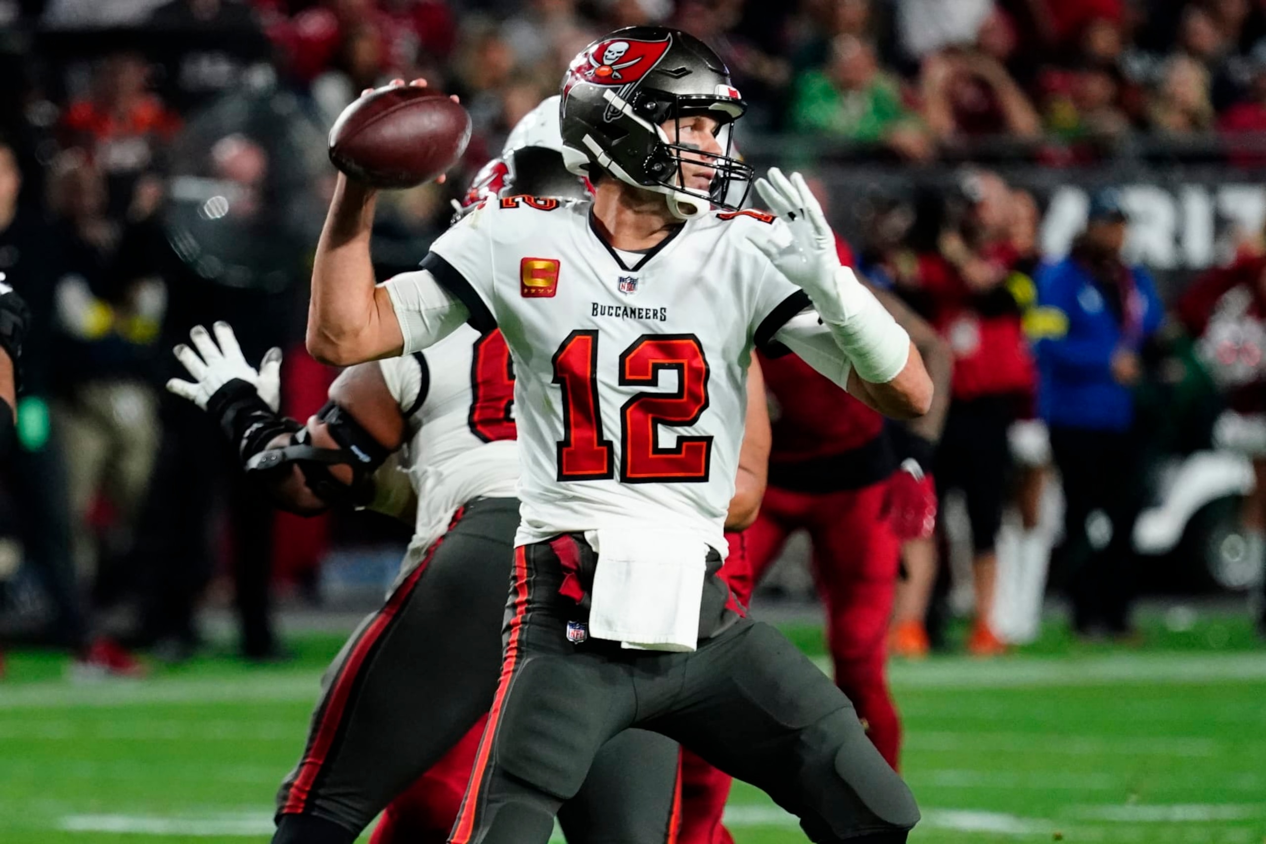 Tampa Bay Buccaneers quarterback Tom Brady (12) throws against the Arizona Cardinals during the second half of an NFL football game, Sunday, Dec. 25, 2022, in Glendale, Ariz. (AP Photo/Darryl Webb)