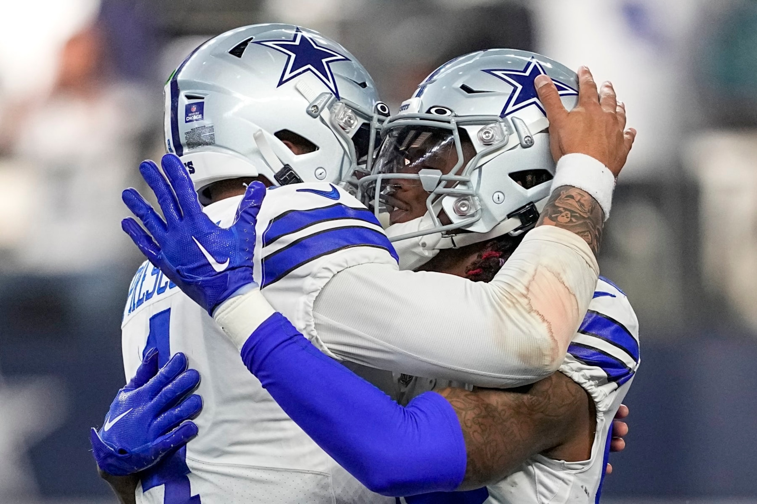Dallas Cowboys' CeeDee Lamb celebrates his touchdown catch with Dak Prescott during the first half of an NFL football game against the Philadelphia Eagles Saturday, Dec. 24, 2022, in Arlington, Texas. (AP Photo/Tony Gutierrez)