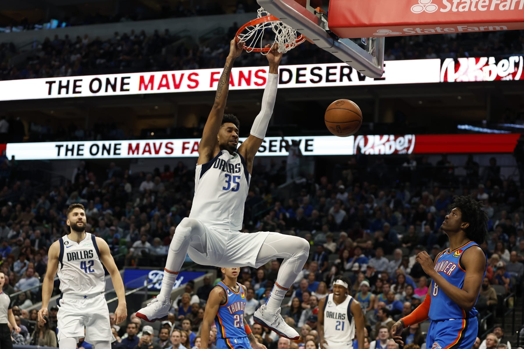 DALLAS, TEXAS - DECEMBER 12: Christian Wood #35 of the Dallas Mavericks dunks the ball against the Oklahoma City Thunder in the second half at American Airlines Center on December 12, 2022 in Dallas, Texas. NOTE TO USER: User expressly acknowledges and agrees that, by downloading and or using this photograph, User is consenting to the terms and conditions of the Getty Images License Agreement.  (Photo by Tim Heitman/Getty Images)