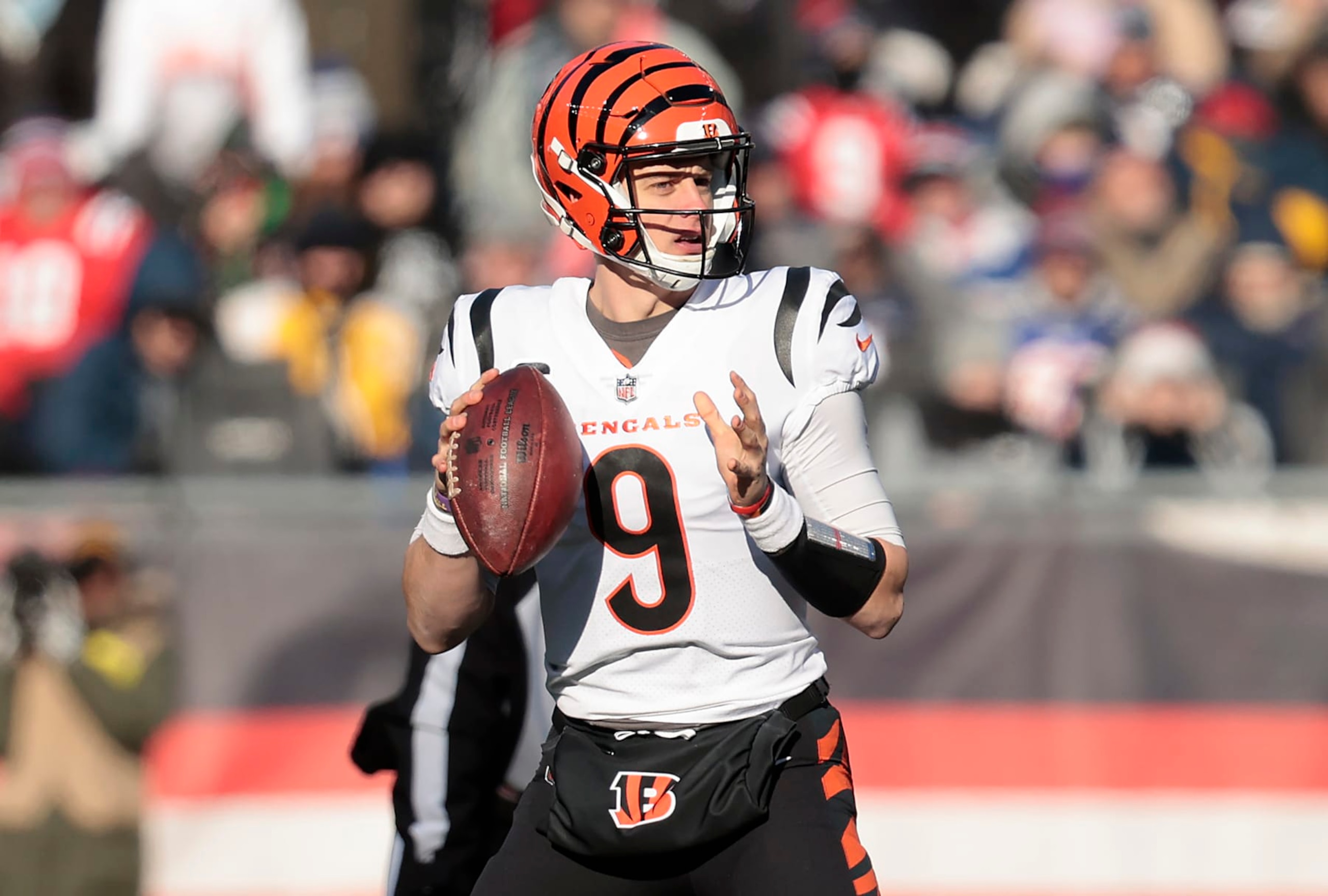 FOXBOROUGH, MASSACHUSETTS - DECEMBER 24: Joe Burrow #9 of the Cincinnati Bengals attempts a pass during the first quarter against the New England Patriots at Gillette Stadium on December 24, 2022 in Foxborough, Massachusetts. (Photo by Nick Grace/Getty Images)