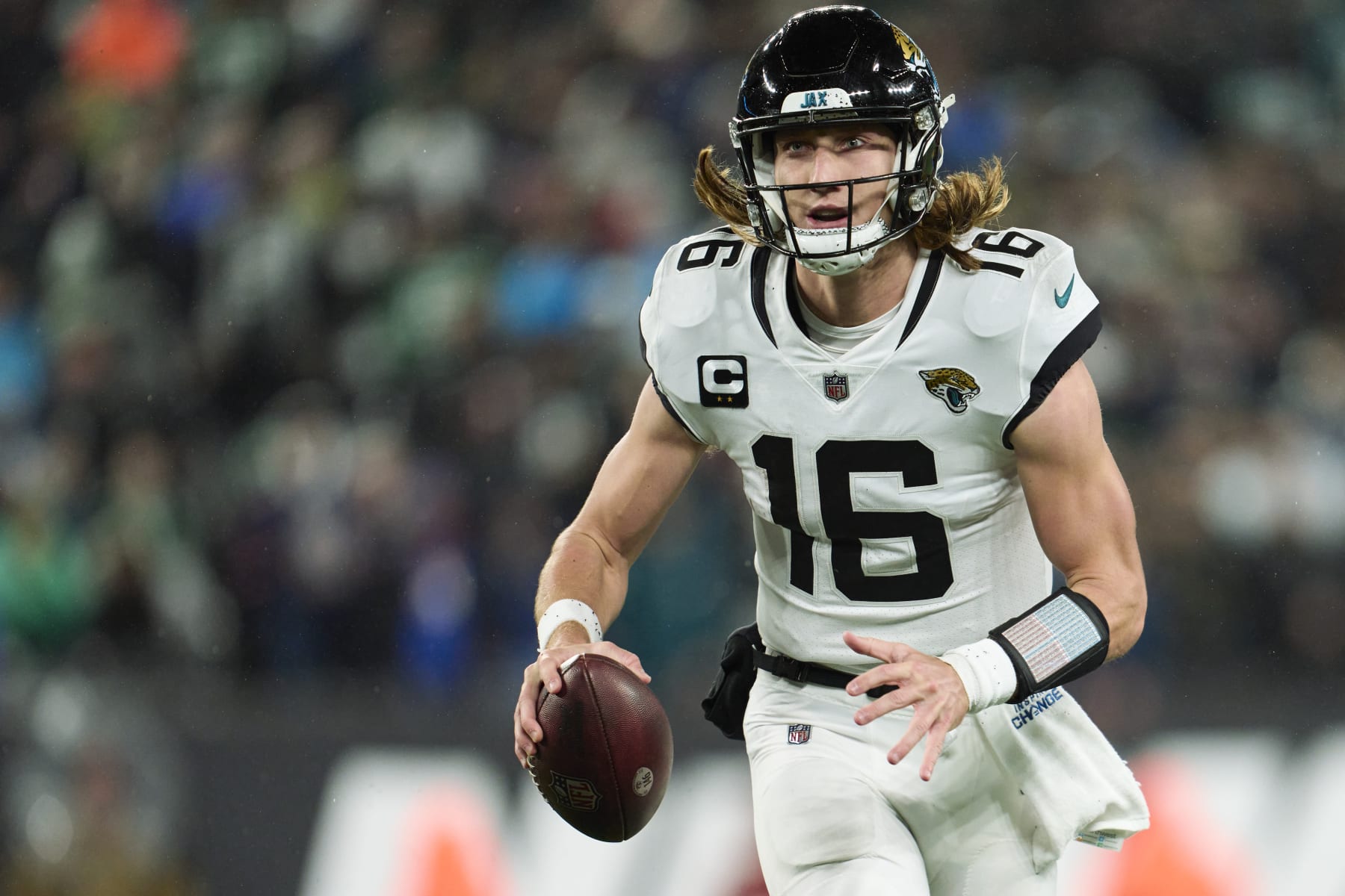 EAST RUTHERFORD, NJ - DECEMBER 22: Trevor Lawrence #16 of the Jacksonville Jaguars scrambles against the New York Jets during the first half at MetLife Stadium on December 22, 2022 in East Rutherford, New Jersey. (Photo by Cooper Neill/Getty Images)