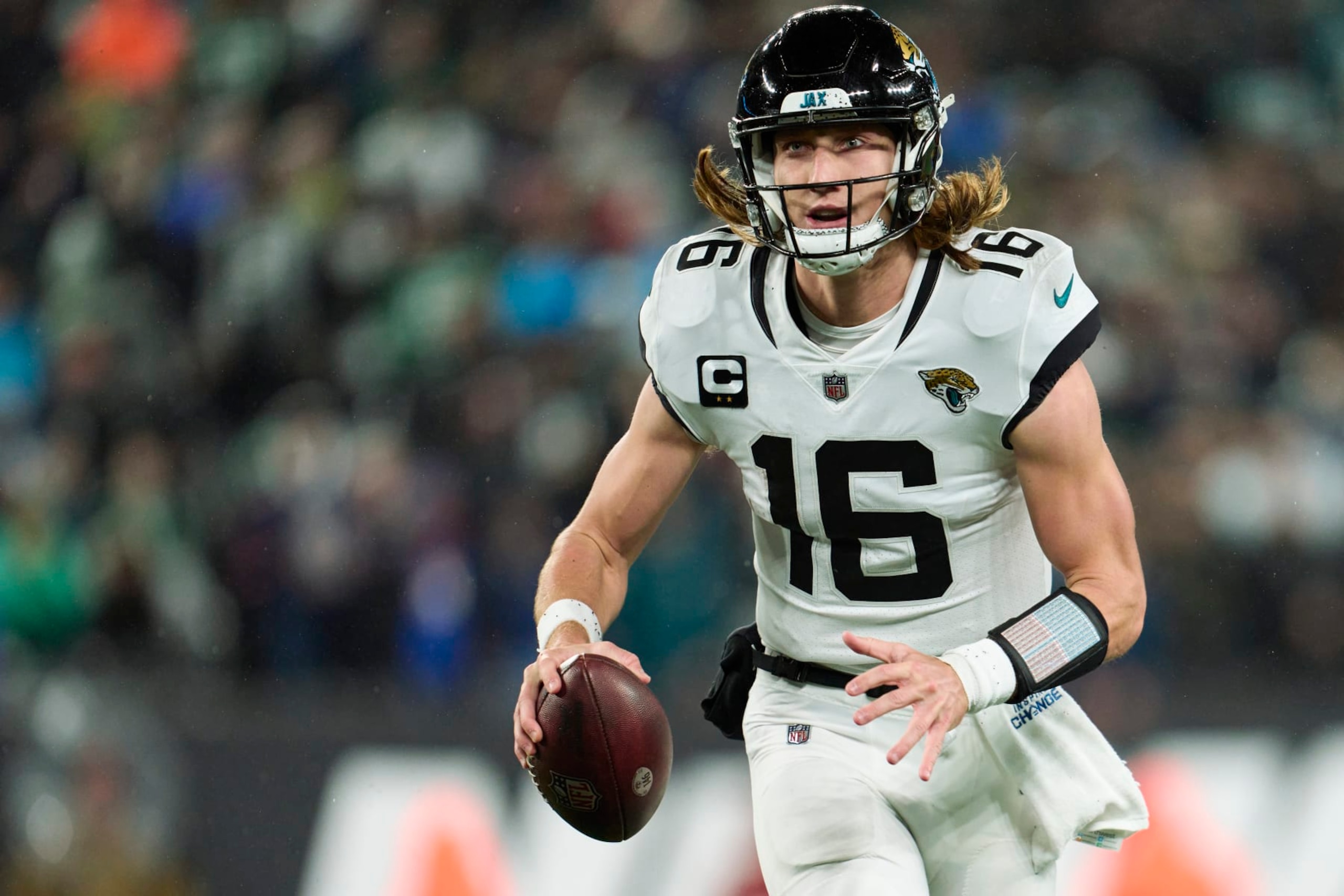 EAST RUTHERFORD, NJ - DECEMBER 22: Trevor Lawrence #16 of the Jacksonville Jaguars scrambles against the New York Jets during the first half at MetLife Stadium on December 22, 2022 in East Rutherford, New Jersey. (Photo by Cooper Neill/Getty Images)
