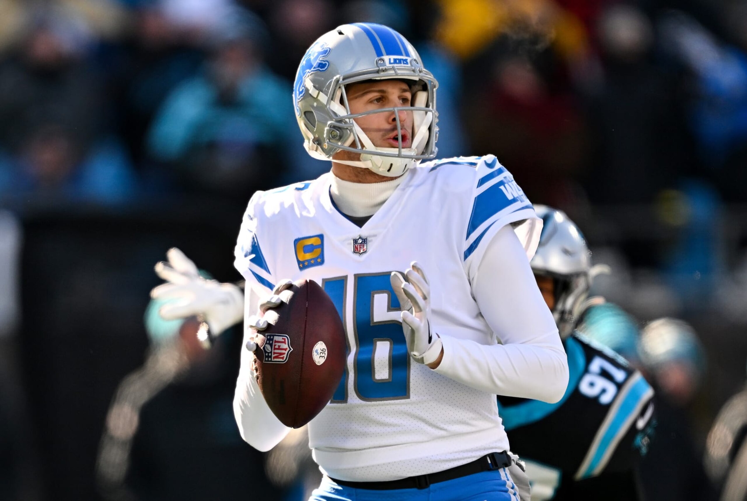 CHARLOTTE, NORTH CAROLINA - DECEMBER 24: Jared Goff #16 of the Detroit Lions looks to pass against the Carolina Panthers during the first half of the game at Bank of America Stadium on December 24, 2022 in Charlotte, North Carolina. (Photo by Grant Halverson/Getty Images)