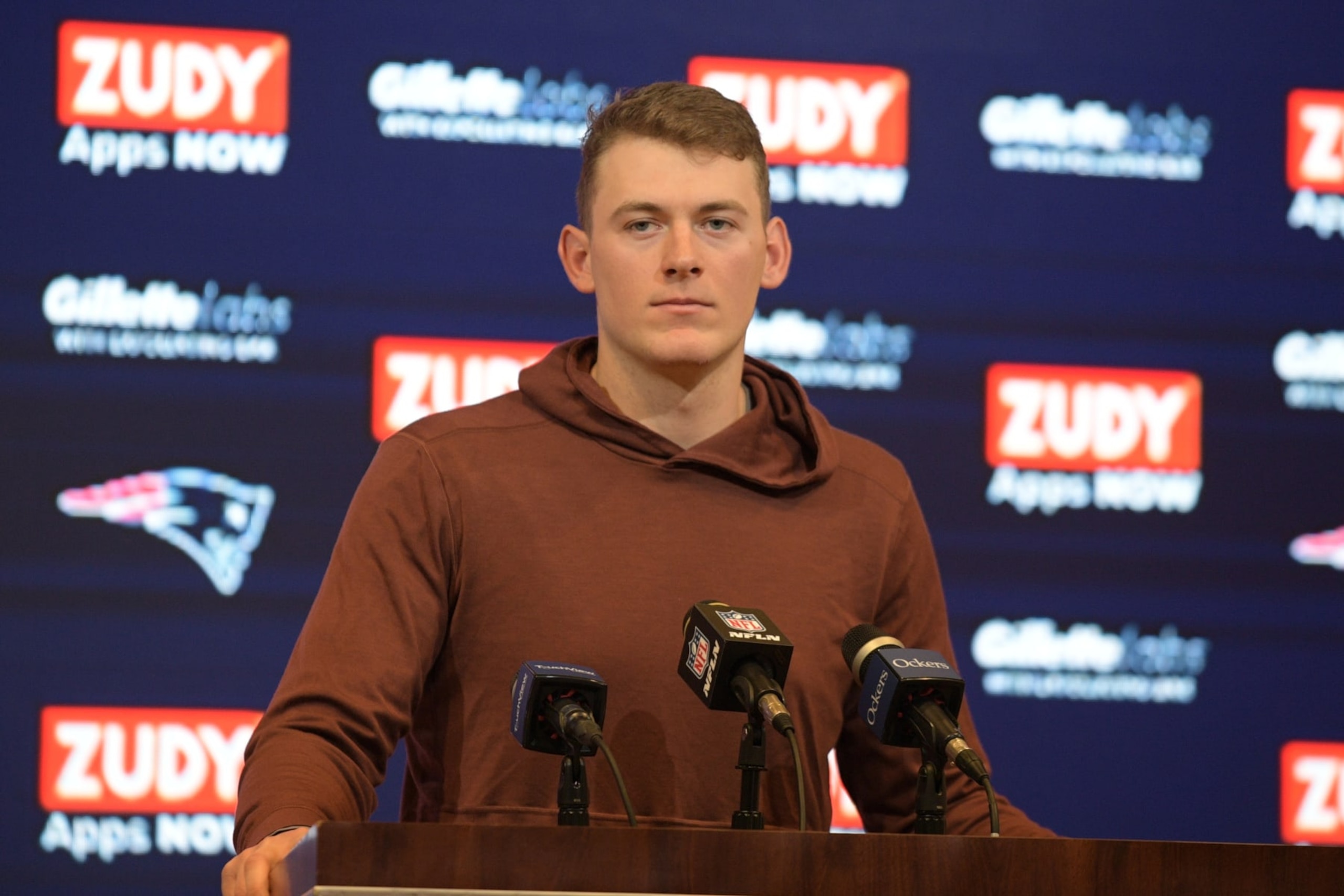 FOXBOROUGH, MA - DECEMBER 24: New England Patriots quarterback Mac Jones (10) answers questions during the press conference following a game between the New England Patriots and the Cincinnati Bengals on December 24, 2022, at Gillette Stadium in Foxborough, Massachusetts. The Bengals defeated the Patriots 22-18. (Photo by Erica Denhoff/Icon Sportswire via Getty Images)