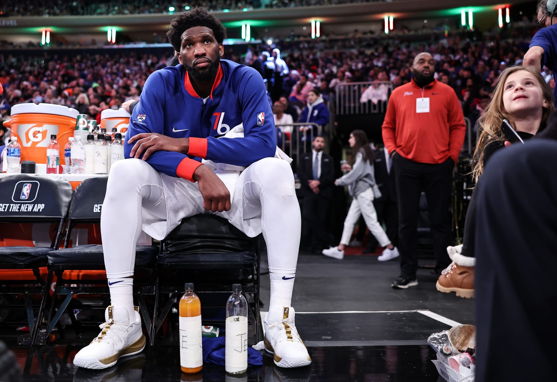 NEW YORK, NEW YORK - DECEMBER 25: Joel Embiid #21 of the Philadelphia 76ers looks on from the bench during the fourth quarter of the game against the New York Knicks at Madison Square Garden on December 25, 2022 in New York City.  NOTE TO USER: User expressly acknowledges and agrees that, by downloading and or using this photograph, User is consenting to the terms and conditions of the Getty Images License Agreement. (Photo by Dustin Satloff/Getty Images)