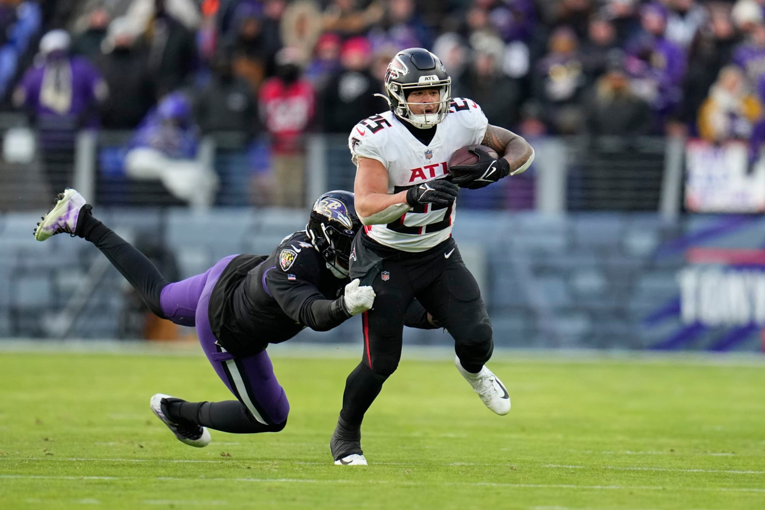 Atlanta Falcons running back Tyler Allgeier (25) carries during the second half of an NFL football game against the Baltimore Ravens, Saturday, Dec. 24, 2022, in Baltimore. (AP Photo/Julio Cortez)