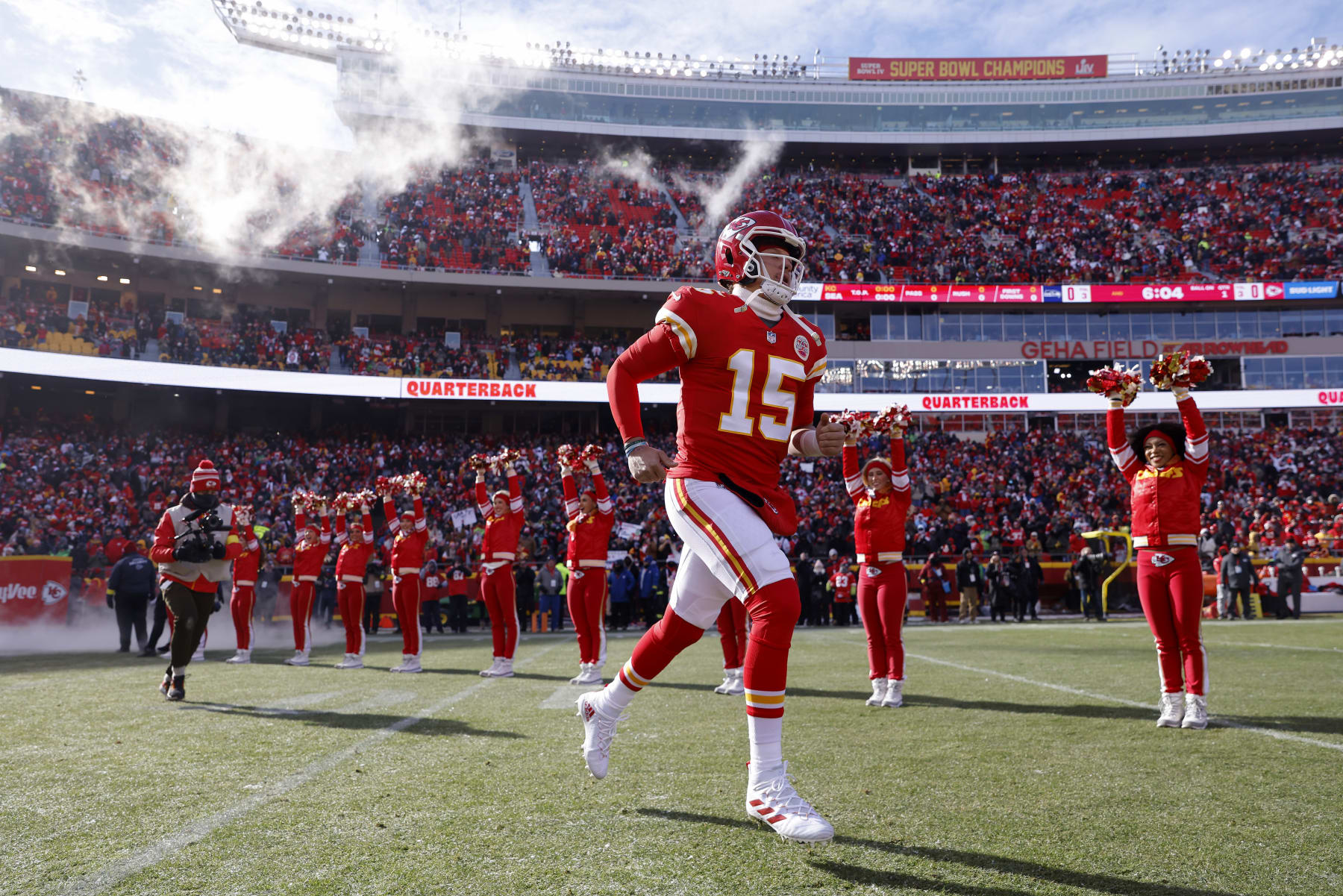 KANSAS CITY, MISSOURI - DECEMBER 24: Patrick Mahomes #15 of the Kansas City Chiefs runs onto the field during pregame against the Seattle Seahawks at Arrowhead Stadium on December 24, 2022 in Kansas City, Missouri. (Photo by David Eulitt/Getty Images)