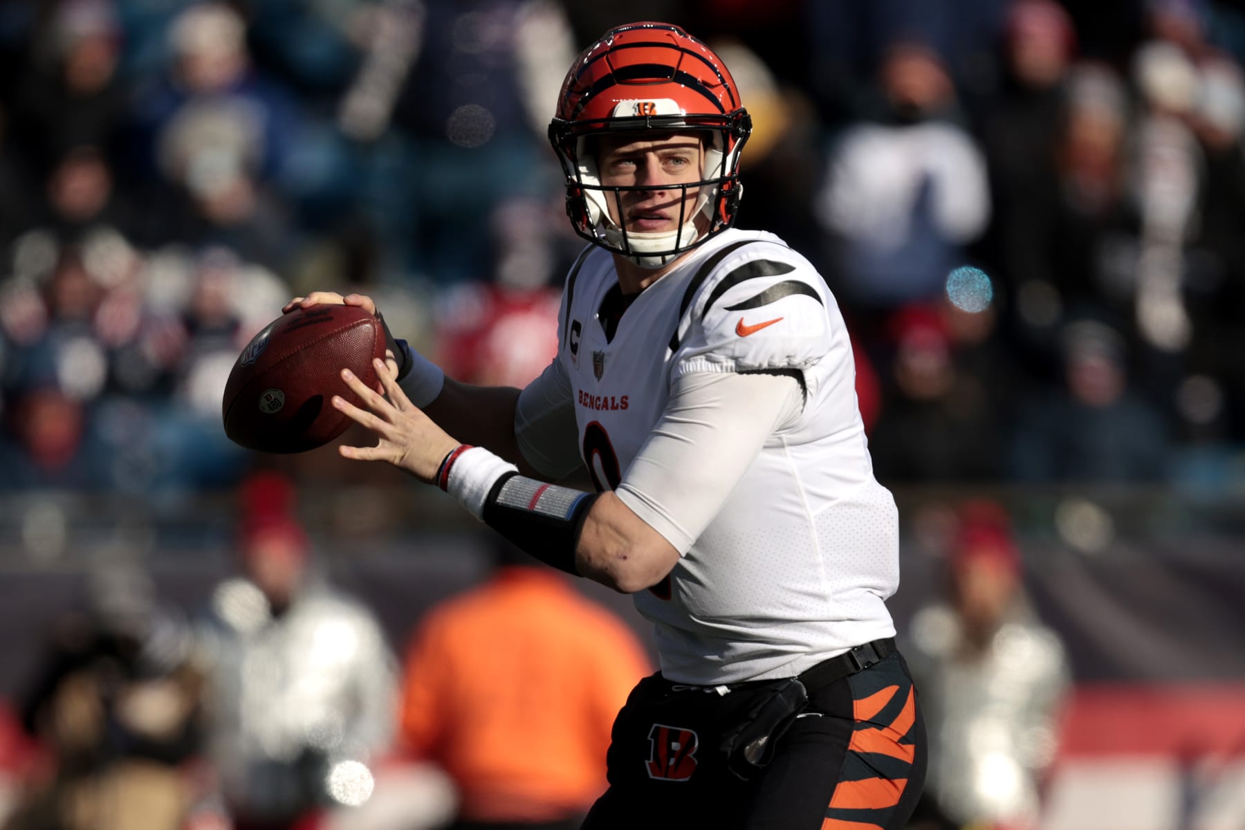FOXBOROUGH, MASSACHUSETTS - DECEMBER 24: Joe Burrow #9 of the Cincinnati Bengals attempts a pass during the first quarter against the New England Patriots at Gillette Stadium on December 24, 2022 in Foxborough, Massachusetts. (Photo by Nick Grace/Getty Images)