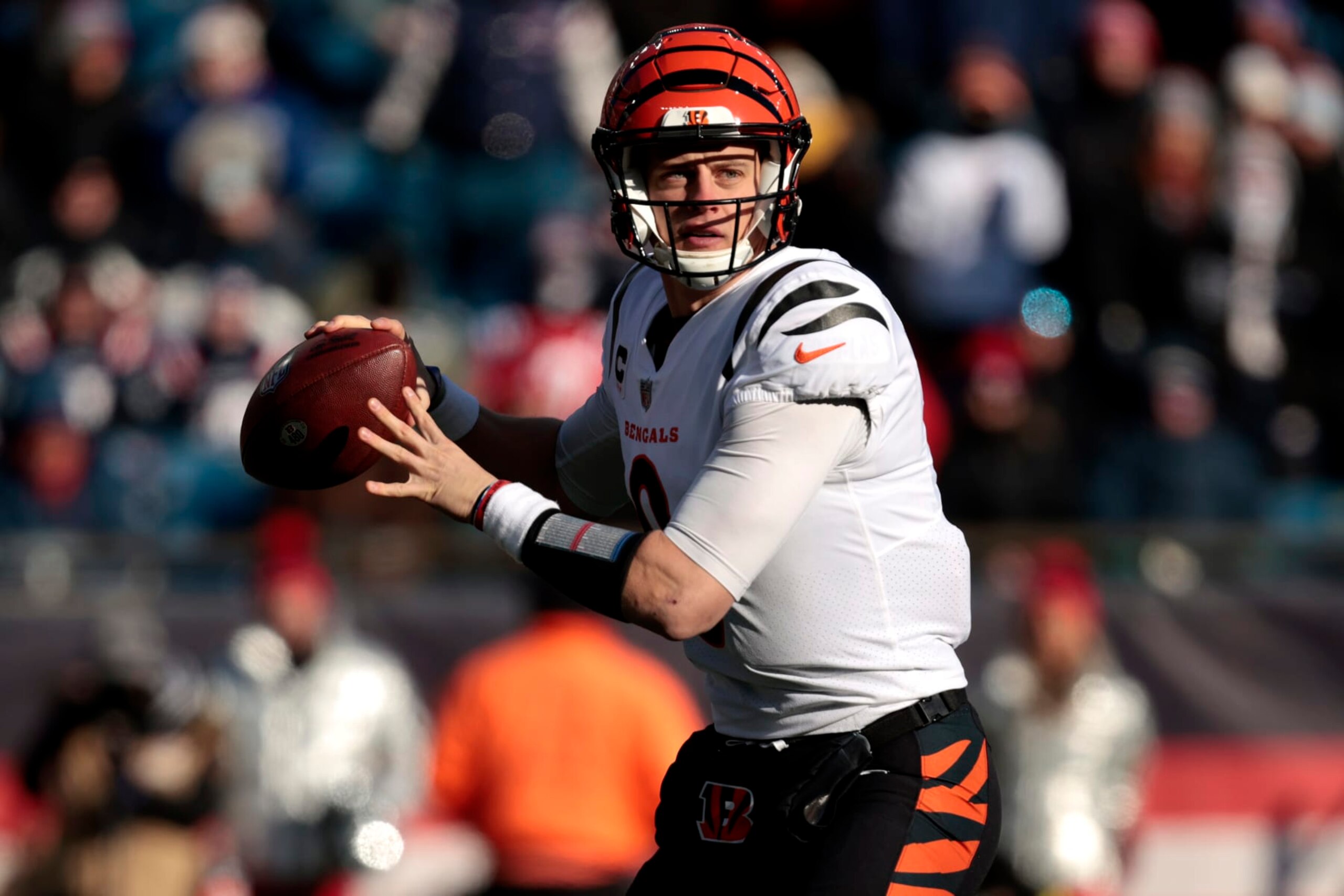 FOXBOROUGH, MASSACHUSETTS - DECEMBER 24: Joe Burrow #9 of the Cincinnati Bengals attempts a pass during the first quarter against the New England Patriots at Gillette Stadium on December 24, 2022 in Foxborough, Massachusetts. (Photo by Nick Grace/Getty Images)