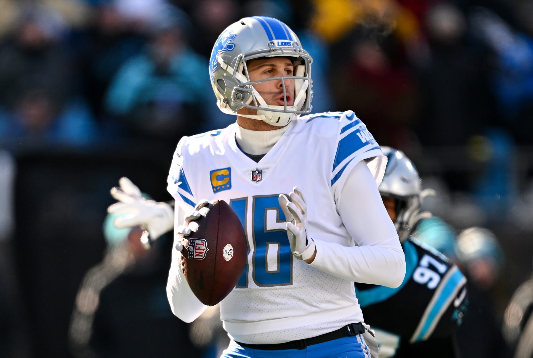 CHARLOTTE, NORTH CAROLINA - DECEMBER 24: Jared Goff #16 of the Detroit Lions looks to pass against the Carolina Panthers during the first half of the game at Bank of America Stadium on December 24, 2022 in Charlotte, North Carolina. (Photo by Grant Halverson/Getty Images)