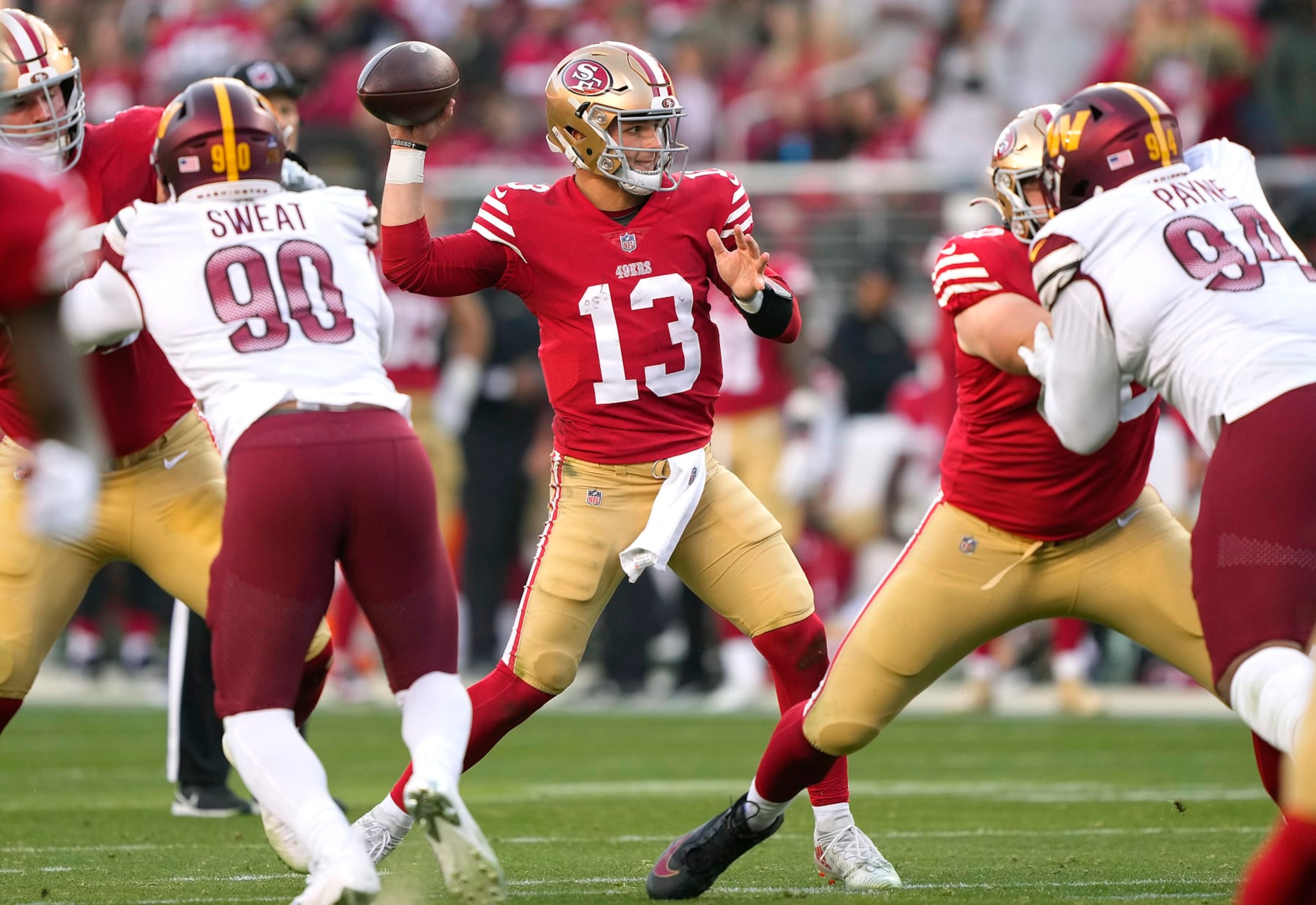 SANTA CLARA, CALIFORNIA - DECEMBER 24: Brock Purdy #13 of the San Francisco 49ers throws a pass against the Washington Commanders during the fourth quarter of an NFL football game at Levi's Stadium on December 24, 2022 in Santa Clara, California. (Photo by Thearon W. Henderson/Getty Images)