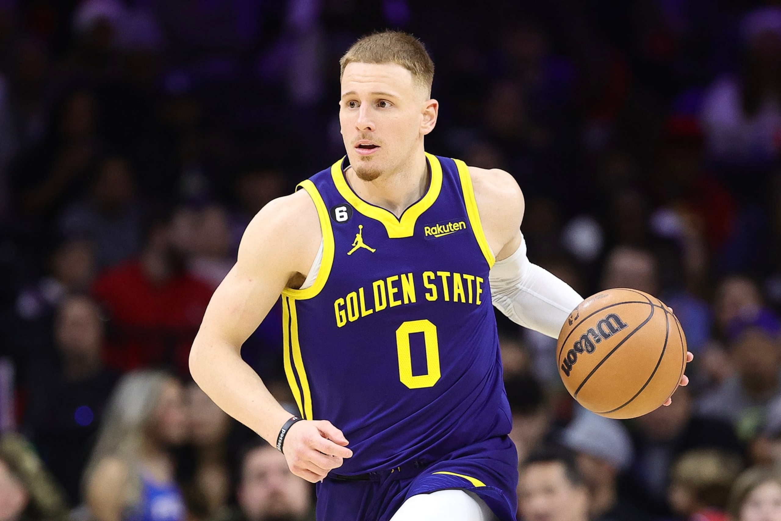 PHILADELPHIA, PENNSYLVANIA - DECEMBER 16: Donte DiVincenzo #0 of the Golden State Warriors dribbkes during the third quarter against the Philadelphia 76ers at Wells Fargo Center on December 16, 2022 in Philadelphia, Pennsylvania. NOTE TO USER: User expressly acknowledges and agrees that, by downloading and or using this photograph, User is consenting to the terms and conditions of the Getty Images License Agreement. (Photo by Tim Nwachukwu/Getty Images)