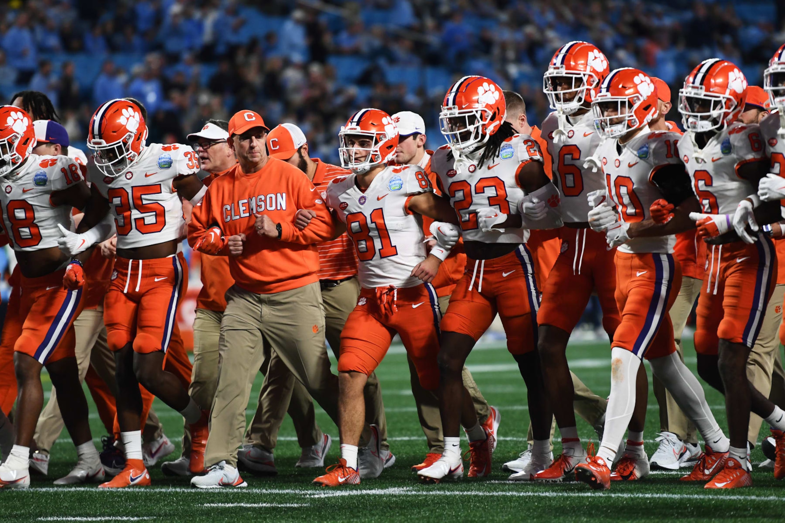 CHARLOTTE, NORTH CAROLINA - DECEMBER 03: Head coach Dabo Swinney of the Clemson Tigers walks with his team before their game against the North Carolina Tar Heels for the ACC Championship at Bank of America Stadium on December 03, 2022 in Charlotte, North Carolina. (Photo by Eakin Howard/Getty Images)