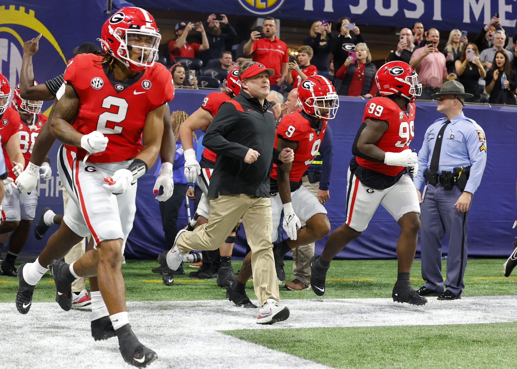 ATLANTA, GA - DECEMBER 03: Head coach Kirby Smart of the Georgia Bulldogs leads the team onto the field prior to the game against the LSU Tigers in the SEC Championship game at Mercedes-Benz Stadium on December 3, 2022 in Atlanta, Georgia. (Photo by Todd Kirkland/Getty Images)