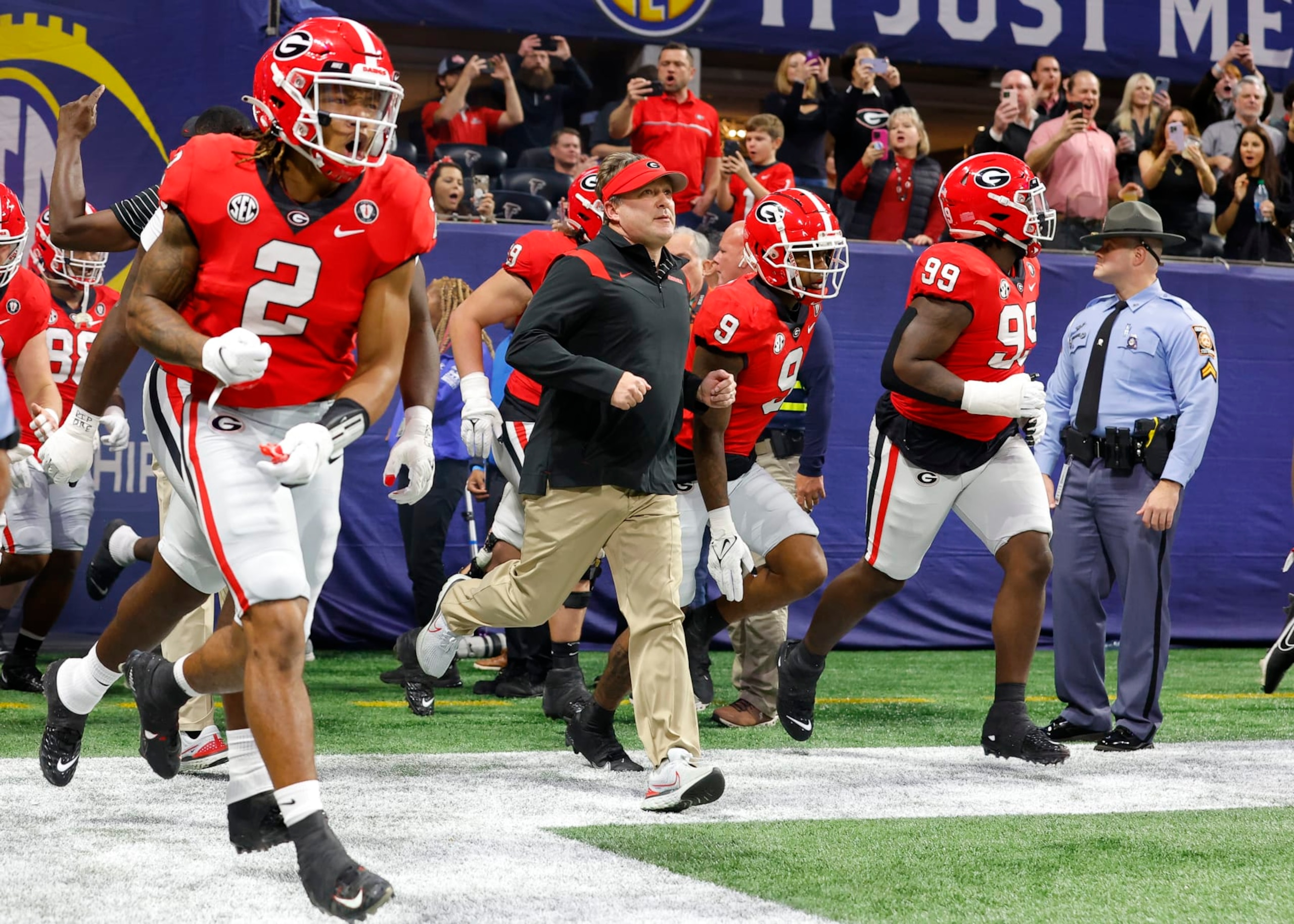 ATLANTA, GA - DECEMBER 03: Head coach Kirby Smart of the Georgia Bulldogs leads the team onto the field prior to the game against the LSU Tigers in the SEC Championship game at Mercedes-Benz Stadium on December 3, 2022 in Atlanta, Georgia. (Photo by Todd Kirkland/Getty Images)