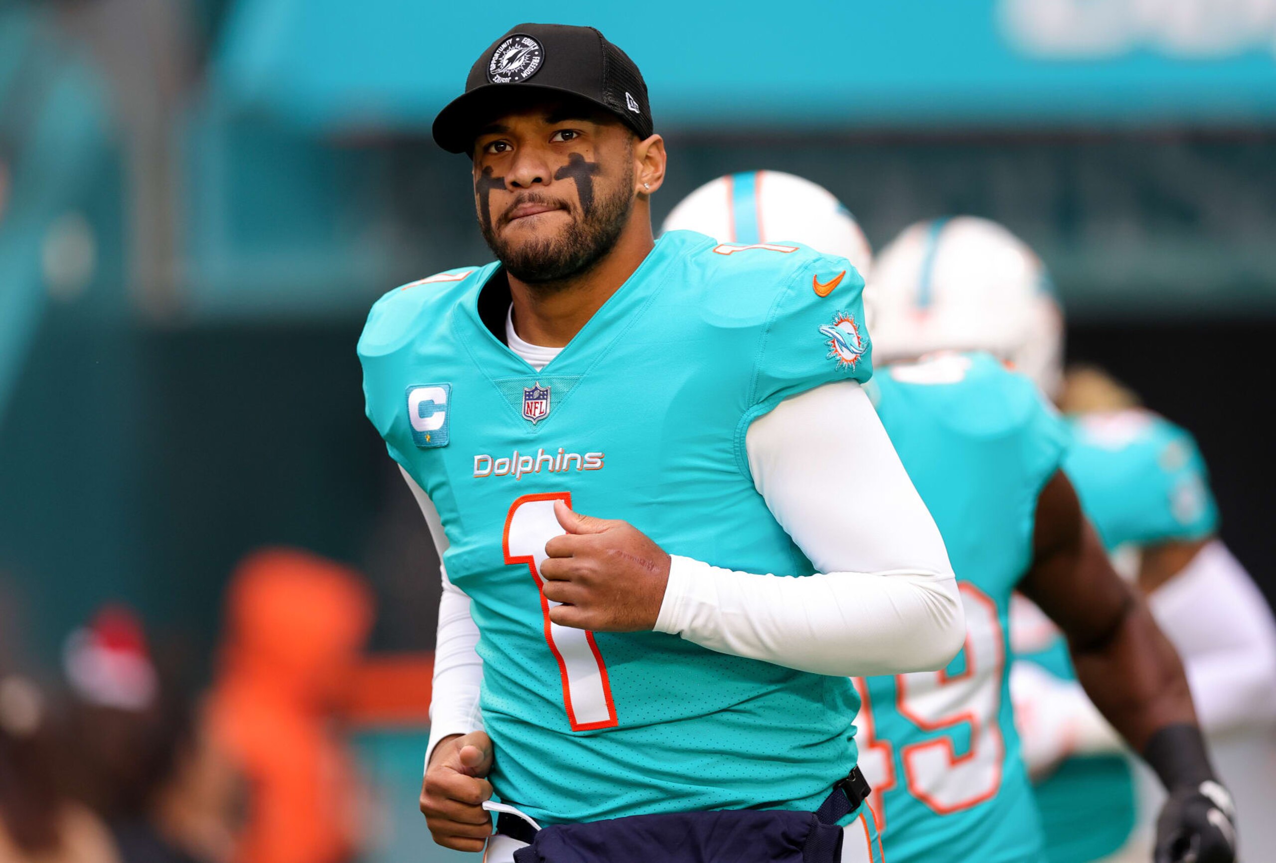 MIAMI GARDENS, FLORIDA - DECEMBER 25: Tua Tagovailoa #1 of the Miami Dolphins takes the field prior to a game against the Green Bay Packers at Hard Rock Stadium on December 25, 2022 in Miami Gardens, Florida. (Photo by Megan Briggs/Getty Images) MIAMI GARDENS, FLORIDA - DECEMBER 25: Tua Tagovailoa #1 of the Miami Dolphins takes the field prior to a game against the Green Bay Packers at Hard Rock Stadium on December 25, 2022 in Miami Gardens, Florida. (Photo by Megan Briggs/Getty Images)