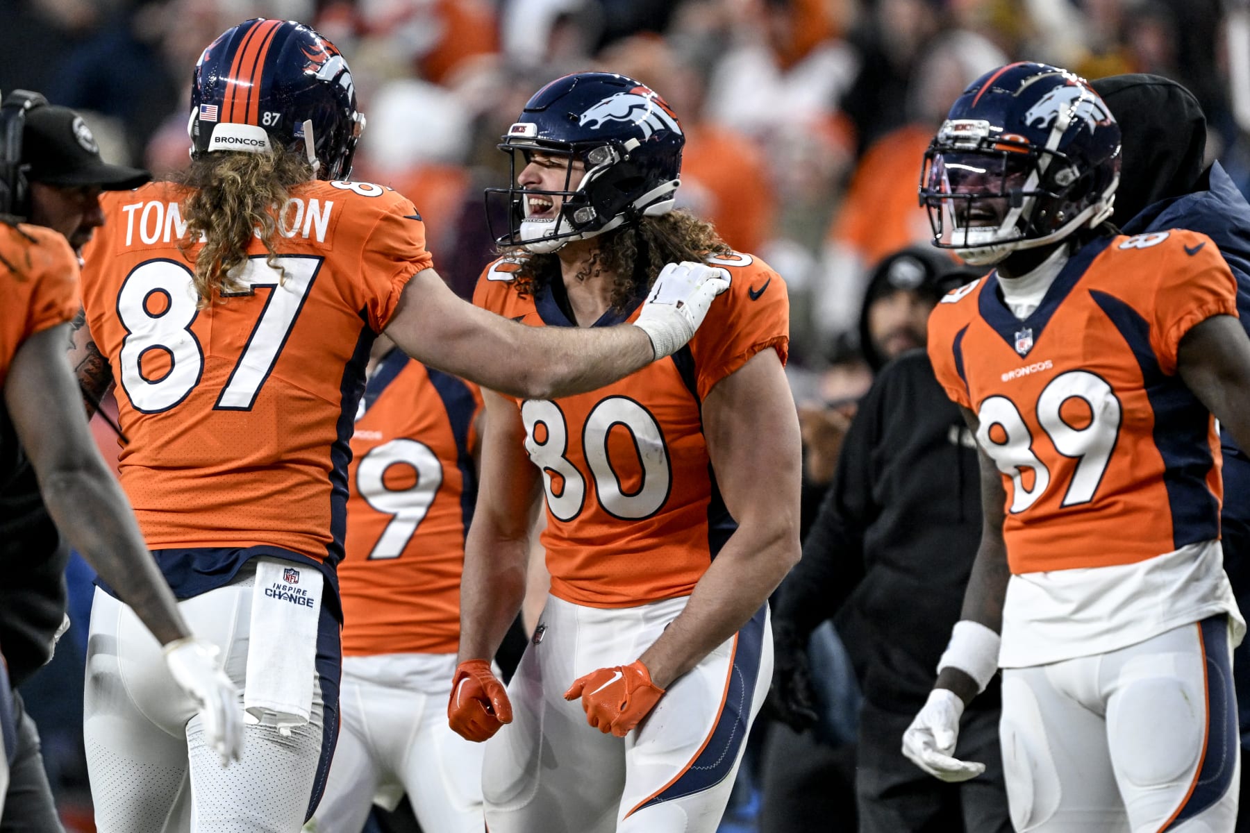 DENVER, CO - DECEMBER 18: Greg Dulcich (80) of the Denver Broncos celebrates a touchdown reception by Eric Tomlinson (87) during the second half of the Broncos 24-15 win over the Arizona Cardinals at Empower Field at Mile High in Denver on Sunday, December 18, 2022. (Photo by AAron Ontiveroz/MediaNews Group/The Denver Post via Getty Images)