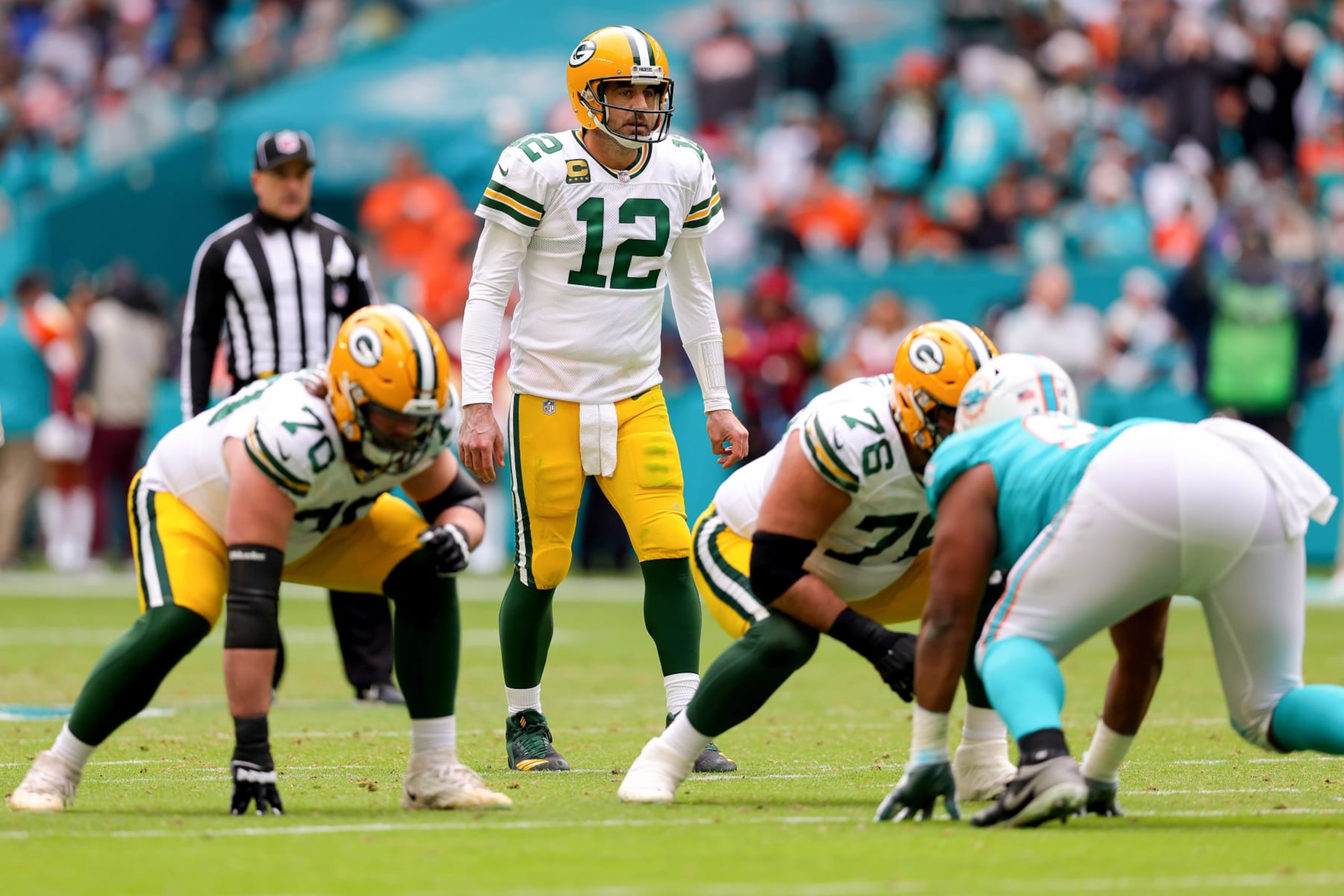 MIAMI GARDENS, FLORIDA - DECEMBER 25: Aaron Rodgers #12 of the Green Bay Packers looks on at the line of scrimmage against the Miami Dolphins during the second half at Hard Rock Stadium on December 25, 2022 in Miami Gardens, Florida. (Photo by Megan Briggs/Getty Images) MIAMI GARDENS, FLORIDA - DECEMBER 25: Aaron Rodgers #12 of the Green Bay Packers looks on at the line of scrimmage against the Miami Dolphins during the second half at Hard Rock Stadium on December 25, 2022 in Miami Gardens, Florida. (Photo by Megan Briggs/Getty Images)