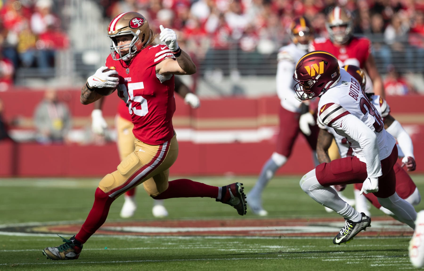 SANTA CLARA, CA - DECEMBER 24: George Kittle #85 of the San Francisco 49ers runs after making a catch during the game against the Washington Commanders at Levi's Stadium on December 24, 2022 in Santa Clara, California. The 49ers defeated the Commanders 37-20. (Photo by Michael Zagaris/San Francisco 49ers/Getty Images)