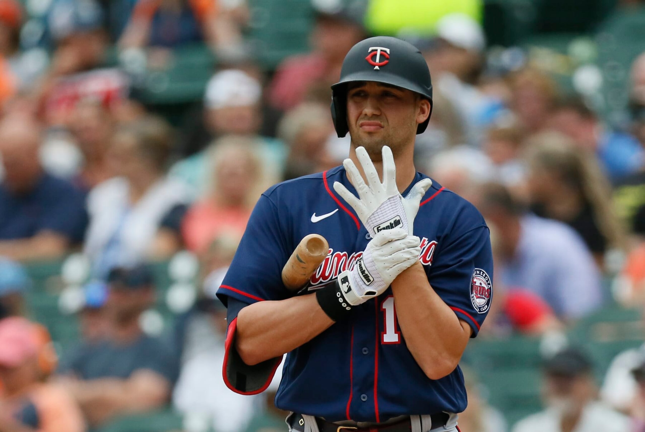 DETROIT, MI -  JULY 24:  Alex Kirilloff #19 of the Minnesota Twins adjusts his Franklin batting gloves during an at-bat against the Detroit Tigers during the first inning at Comerica Park on July 24, 2022, in Detroit, Michigan. (Photo by Duane Burleson/Getty Images)