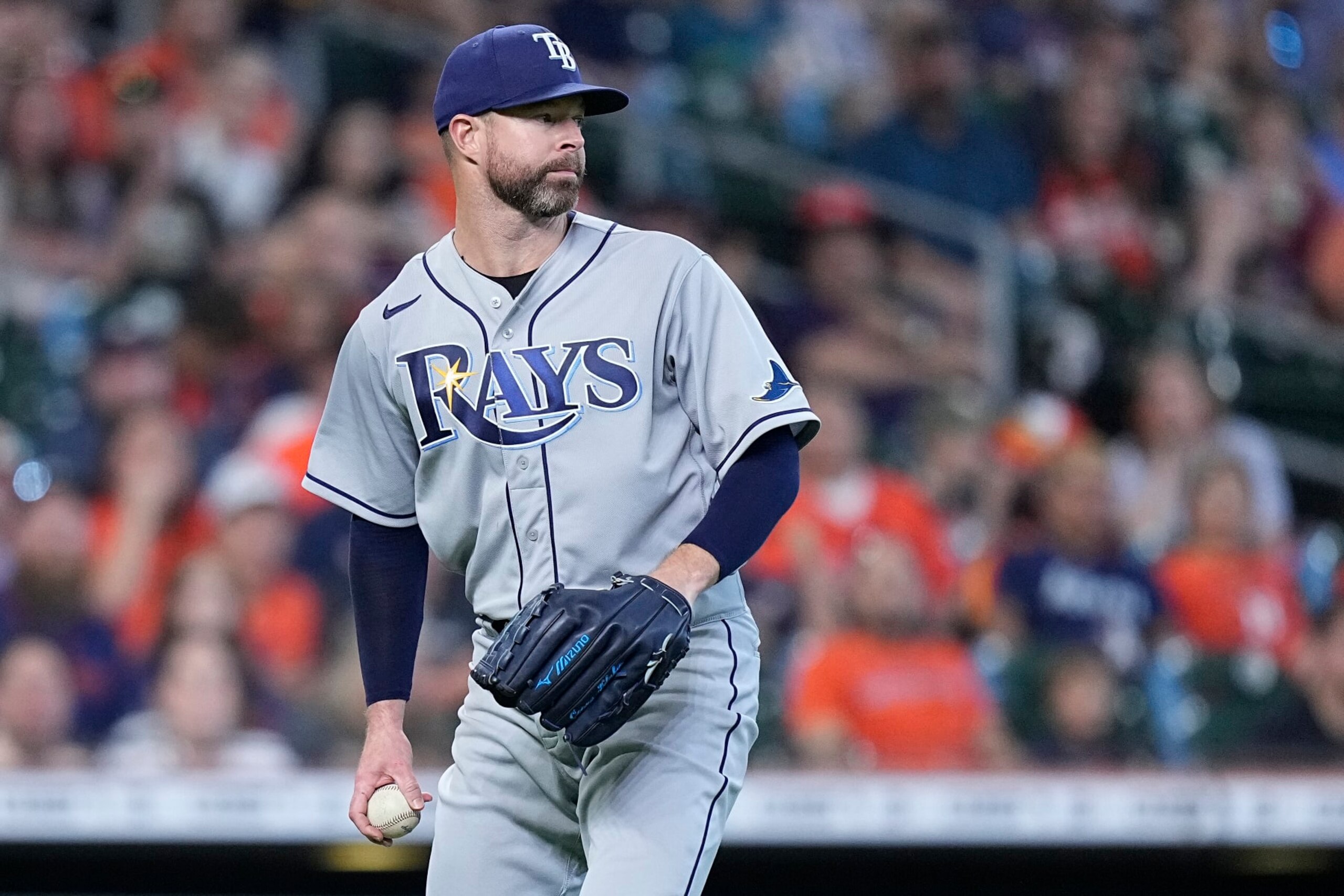 Tampa Bay Rays starting pitcher Corey Kluber holds his throw on a bunt single by Houston Astros' Jeremy Pena during the fifth inning of a baseball game Sunday, Oct. 2, 2022, in Houston. (AP Photo/Kevin M. Cox)