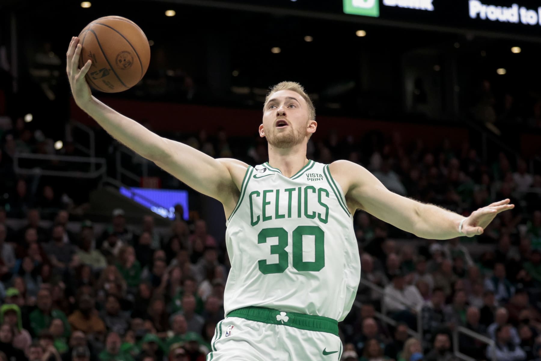 BOSTON, MA - NOVEMBER 28  Sam Hauser #30 of the Boston Celtics drives to the basket during a game against the Charlotte Hornets at TD Garden on November 28, 2022 in Boston, Massachusetts. NOTE TO USER: User expressly acknowledges and agrees that, by downloading and or using this photograph, User is consenting to the terms and conditions of the Getty Images License Agreement. (Photo by Adam Glanzman/Getty Images)